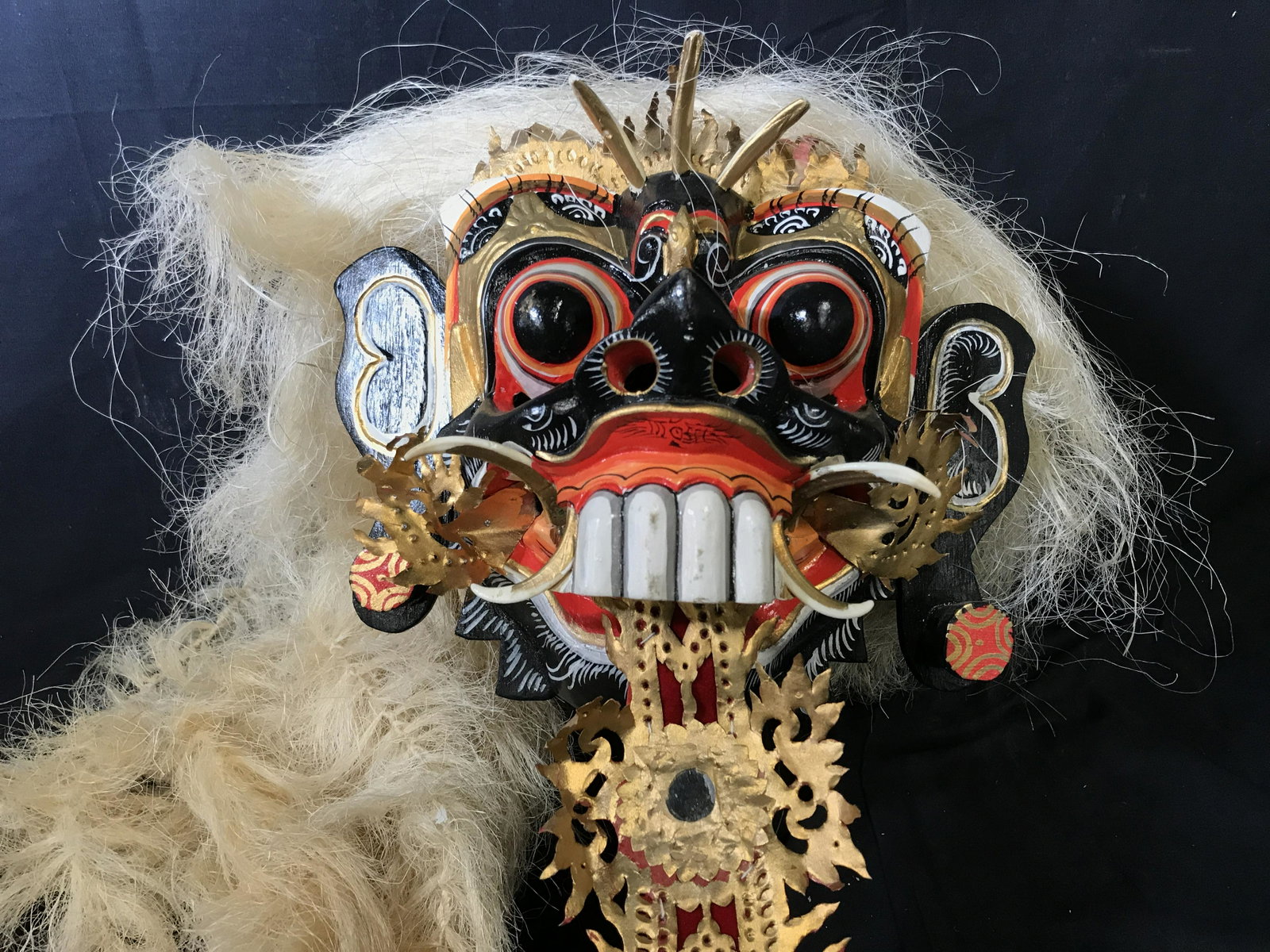 Balinese Rangda Mask: Balinese Rangda Mask, made of hand carved painted wood gold leaf velvet and straw, the mask is representative of the evil goddess Rangda the Demon Queen, the mask is usually paired with the goddesses 