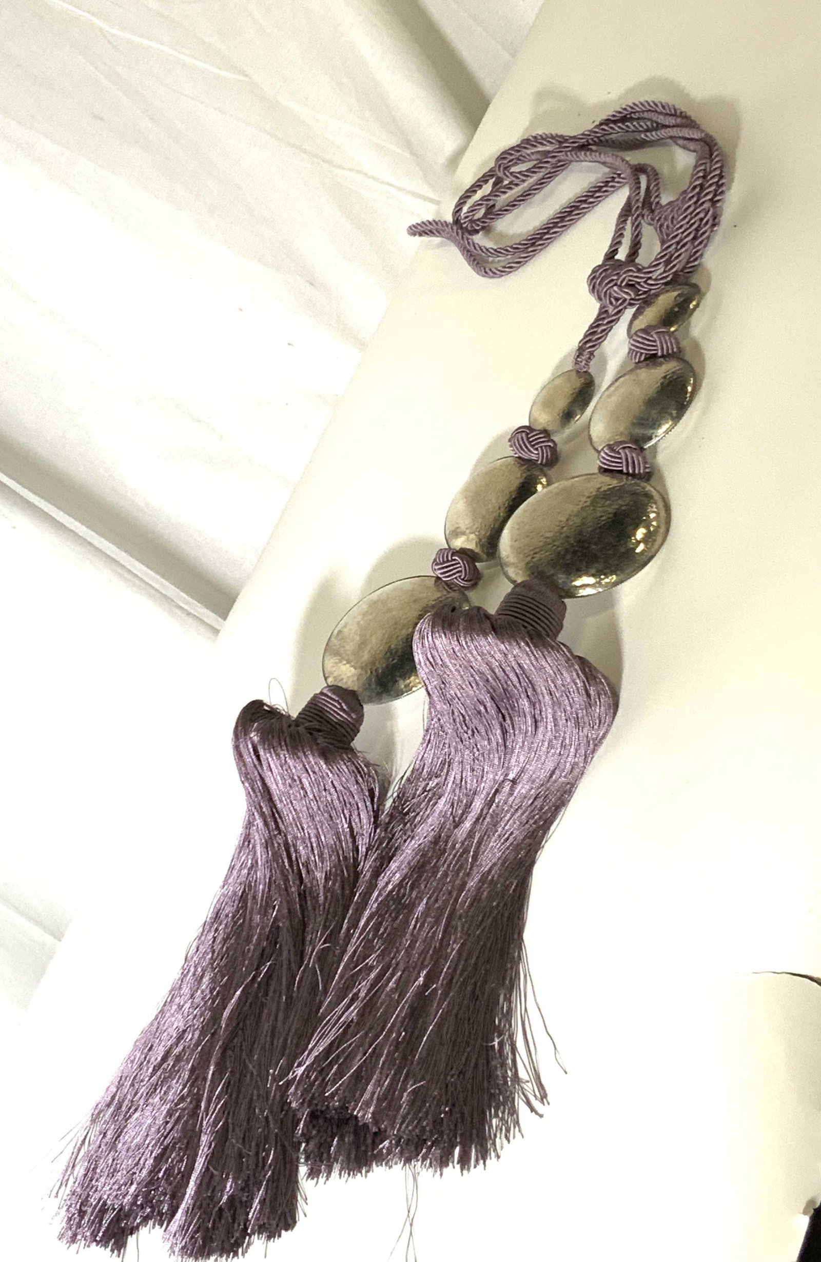 Pair Purple Luxury Woven Drape Tassel Tiebacks: Light Purple luxury tie backs for drapes and curtains. Polished and hammered Silver toned metal circular accents. Approx. 43 in. length. Approx. 5 in. width. Home Decor & Accessories, Window treatment