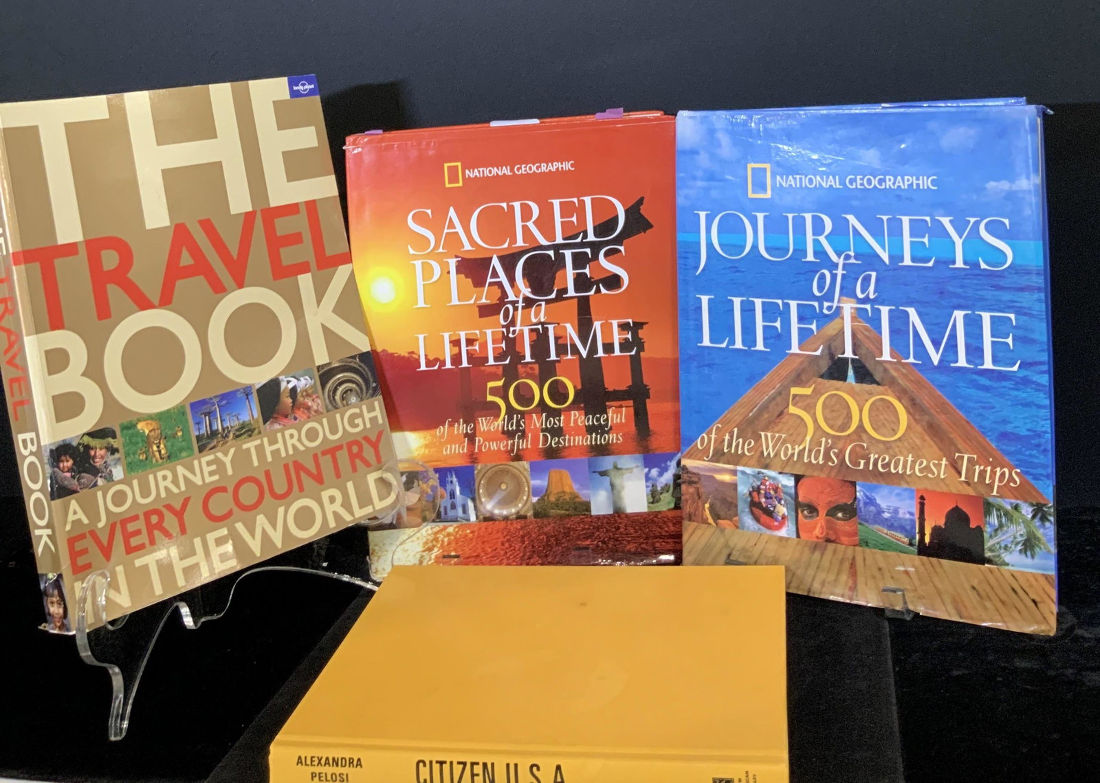 Lot 4 Coffee Table Books, NATIONAL GEOGRAPHIC: Four coffee table books revolving around travel. Titles include: National Geographic: Journeys of a Lifetime, National Geographic: Sacred Places of a Lifetime, Citizen U.S.A.: A 50 State Road Trip (20