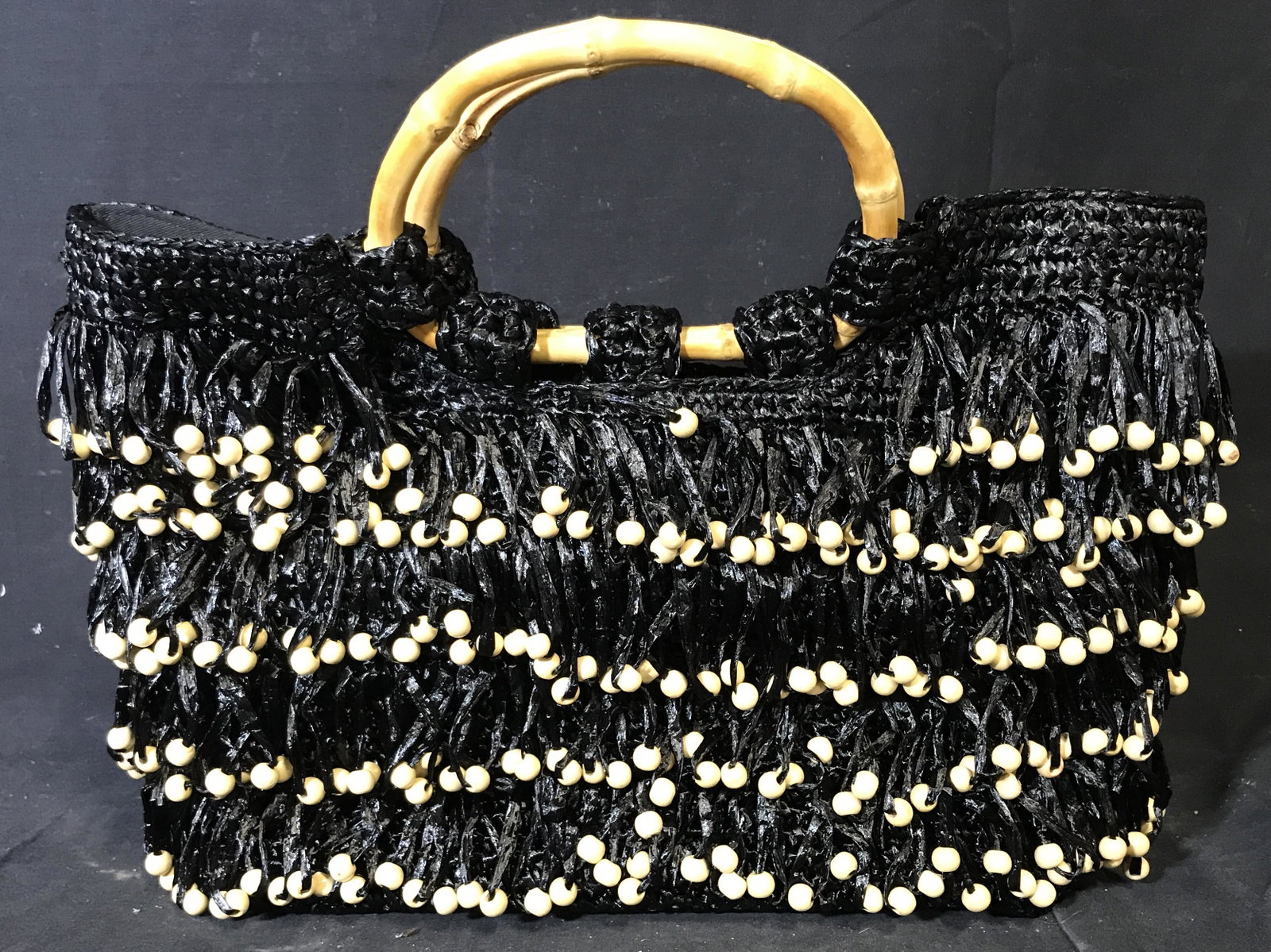COLDWATER CREEK Viscose with Beads Purse: Coldwater creek Viscose with beads Black and Tan purse, exterior of purse is made of black viscose fringes with tan beards attached to the ends of each, bamboo handles to purse, tag to interior reads 