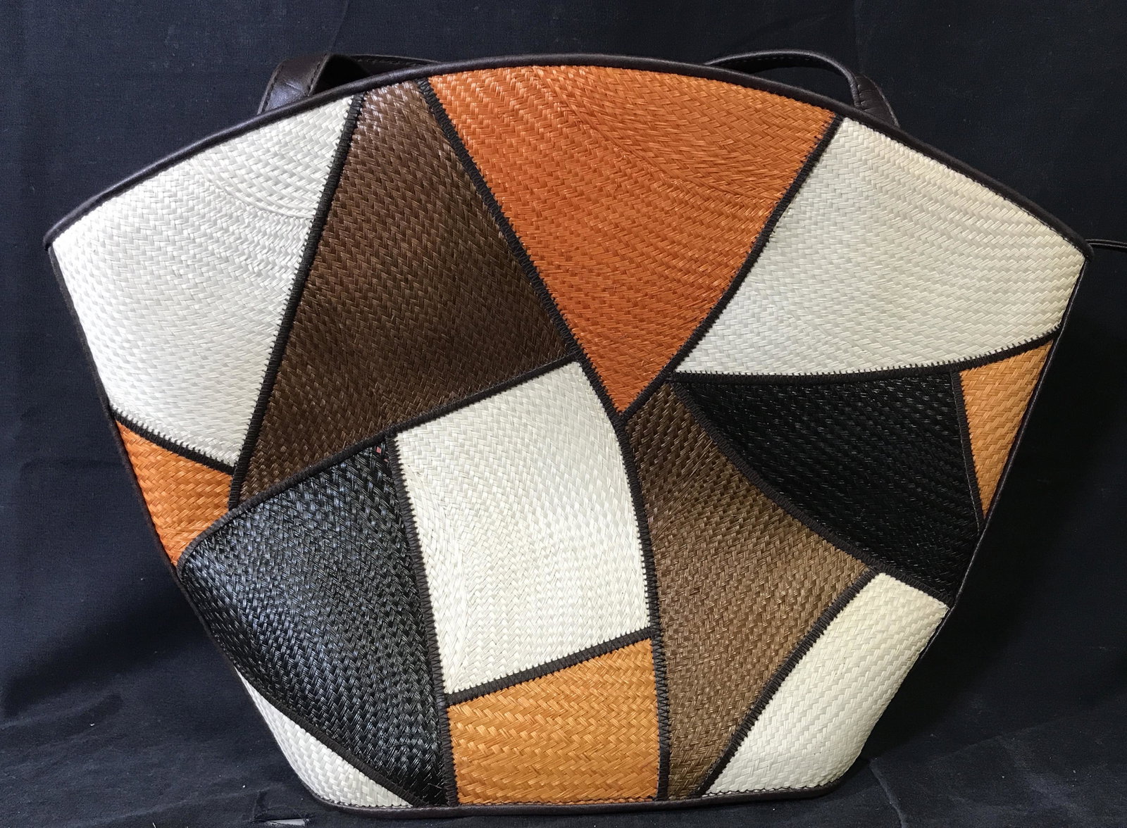 SAC Multicolored Straw Fashion Purse: SAC multicolored straw purse, label to interior reads ‘SAC Handmade in Thailand’, exterior of bag is made of multi colored patches patches of woven straw, a brown leather like material is used for