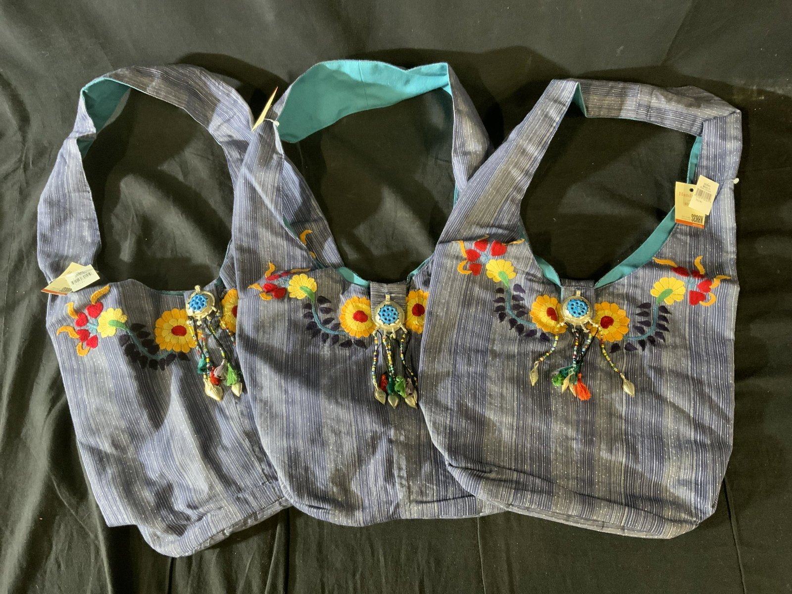 Set 3 SERVV Embroidered Cotton Bags, Pakistan: Set 3 SERVV Embroidered Cotton Bag, Pakistan, labels read ‘Zardozi Hand Embroidered by Afghan Women 100% cotton Dry Clean Only Made in Pakistan’, measures 10 1/2 x 13 1/2 inches, drop measures 12 