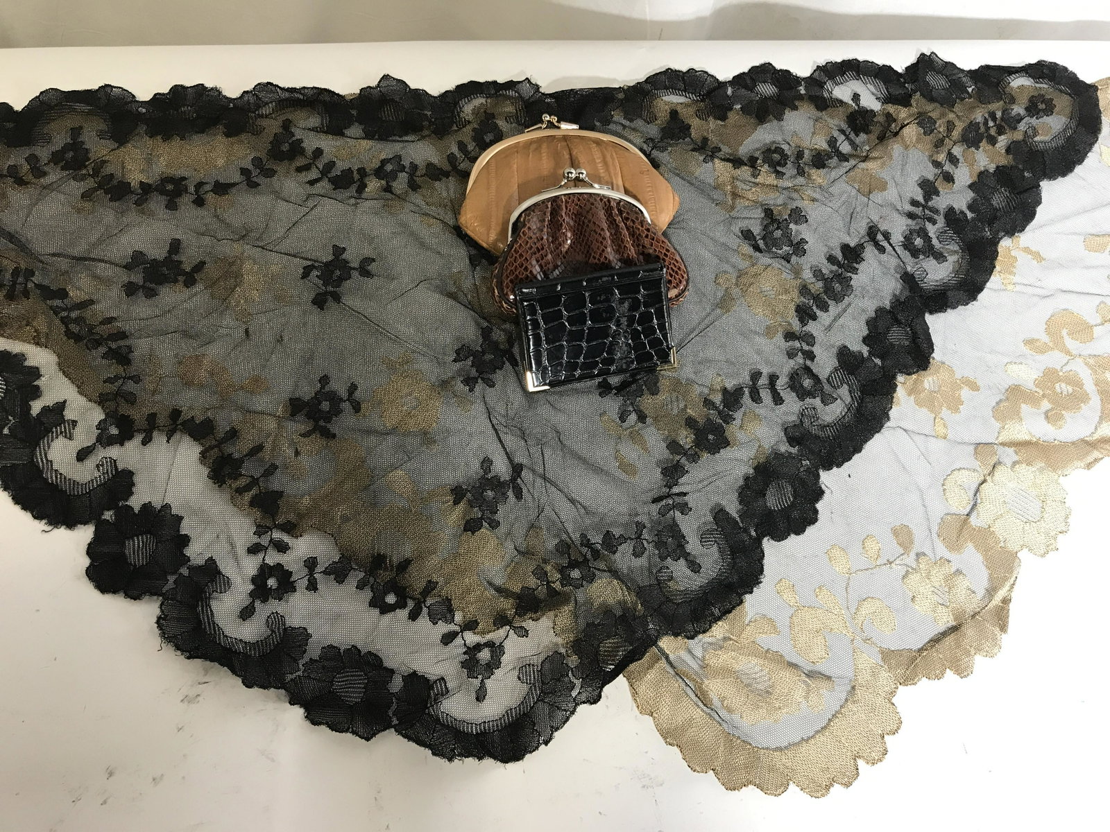 Group Lot of Vintage Ladies Accessories: Group lot of vintage ladies fashion accessories, lot consists of two coin purses a miniature photo album and two lace shawls, tan coin purse label reads ‘Genuine Eel Skin Made in Korea’, label to 