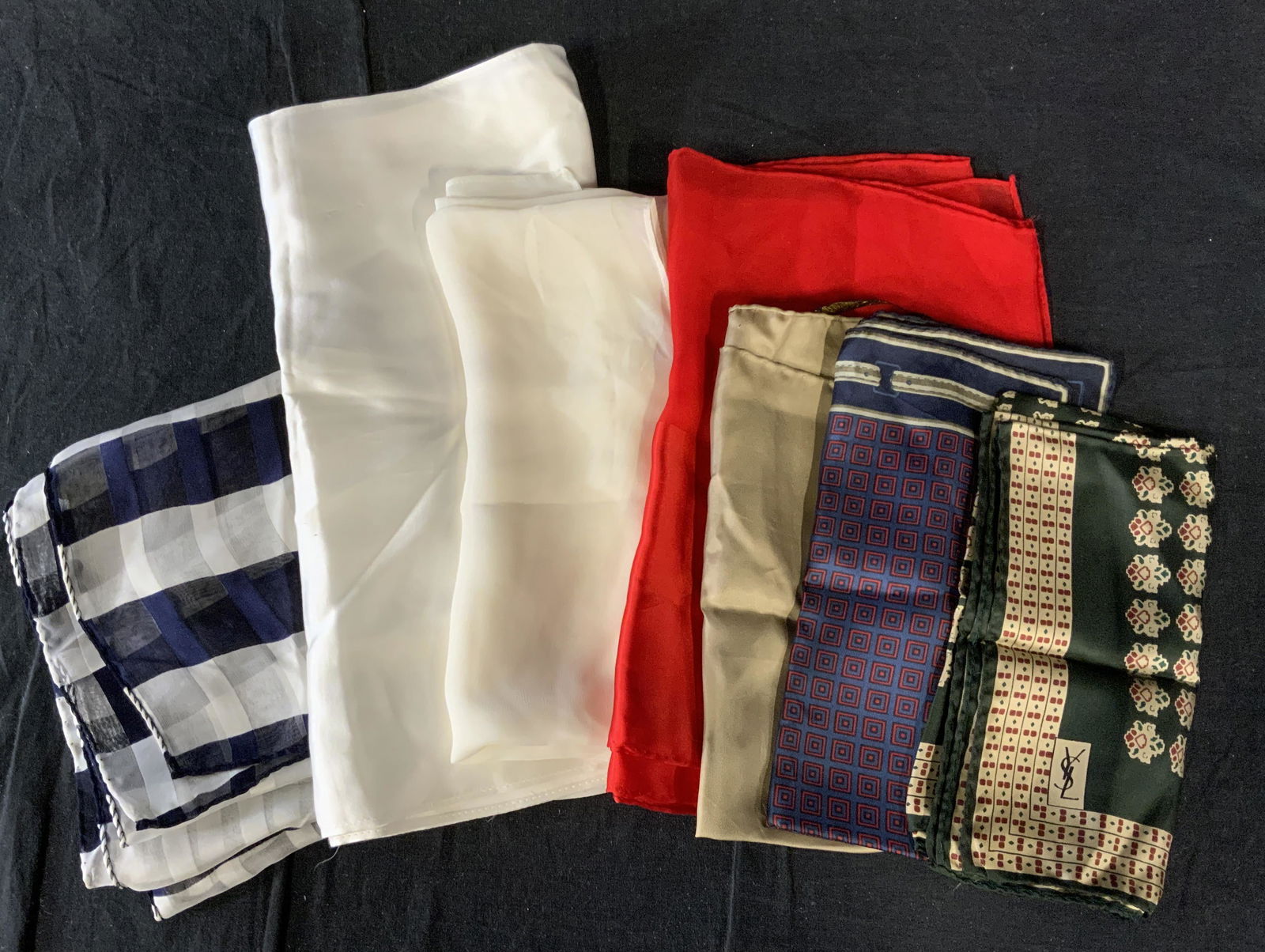 Lot 7 Silk Scarves & Shawls, YSL, Saks, and more: Lot 7 Silk Scarves & Shawls, YSL, Saks, and more, labels and inscriptions read ‘Saks Fifth Avenue Made in Italy 100% silk’, ‘All silk by Ashear Made in Italy Hand rolled in Portugal’, ‘St Jo