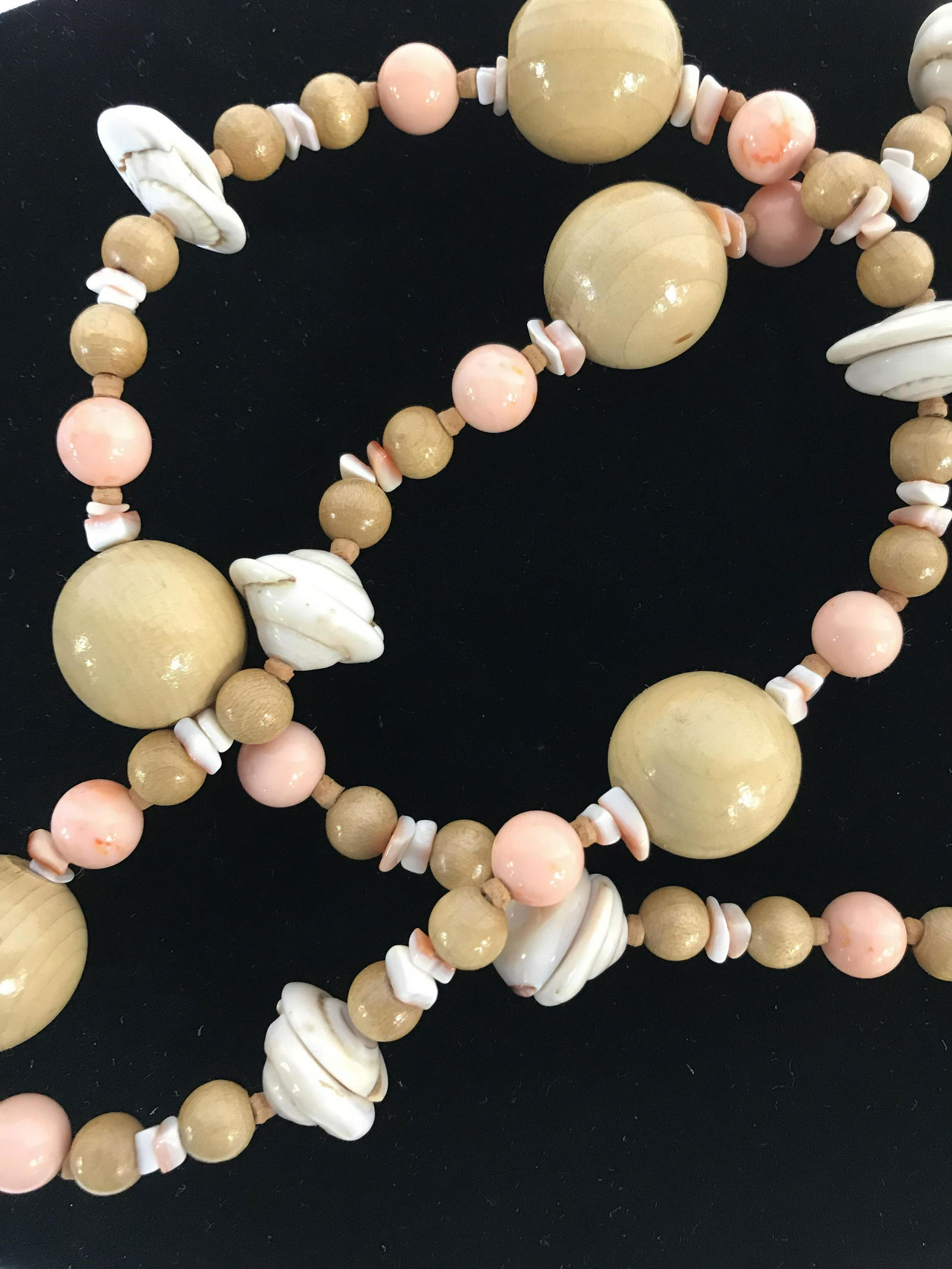 Miriam Haskell Shell, Wood Bead Necklace: Miriam Haskell Vintage Beaded Necklace. Peach color round beads app 8-9 mm, alternating with clear coated 20 mm wood beads & stalls. 34 in. Lobster clasp. Signed on Charm. Artisanal Shell & Bead Neckl