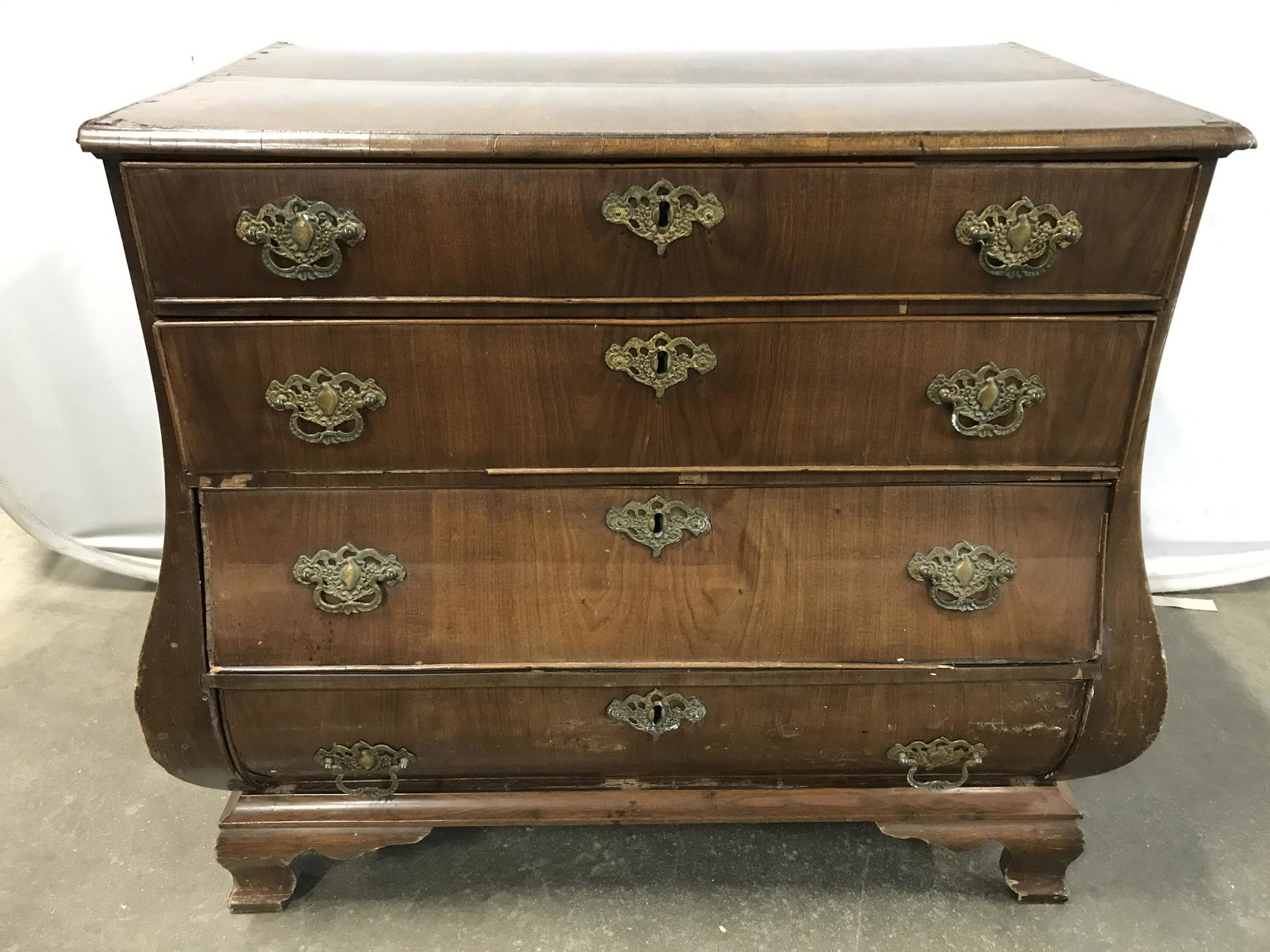 Antique Wooden Commode: Antique wooden commode. Brass drawer pulls, and lock mechanisms present on each drawer. Keys absent, measures approx 31, 32.5 inches w, and 19.25 inches deep. Wear is consistent with age and use, some