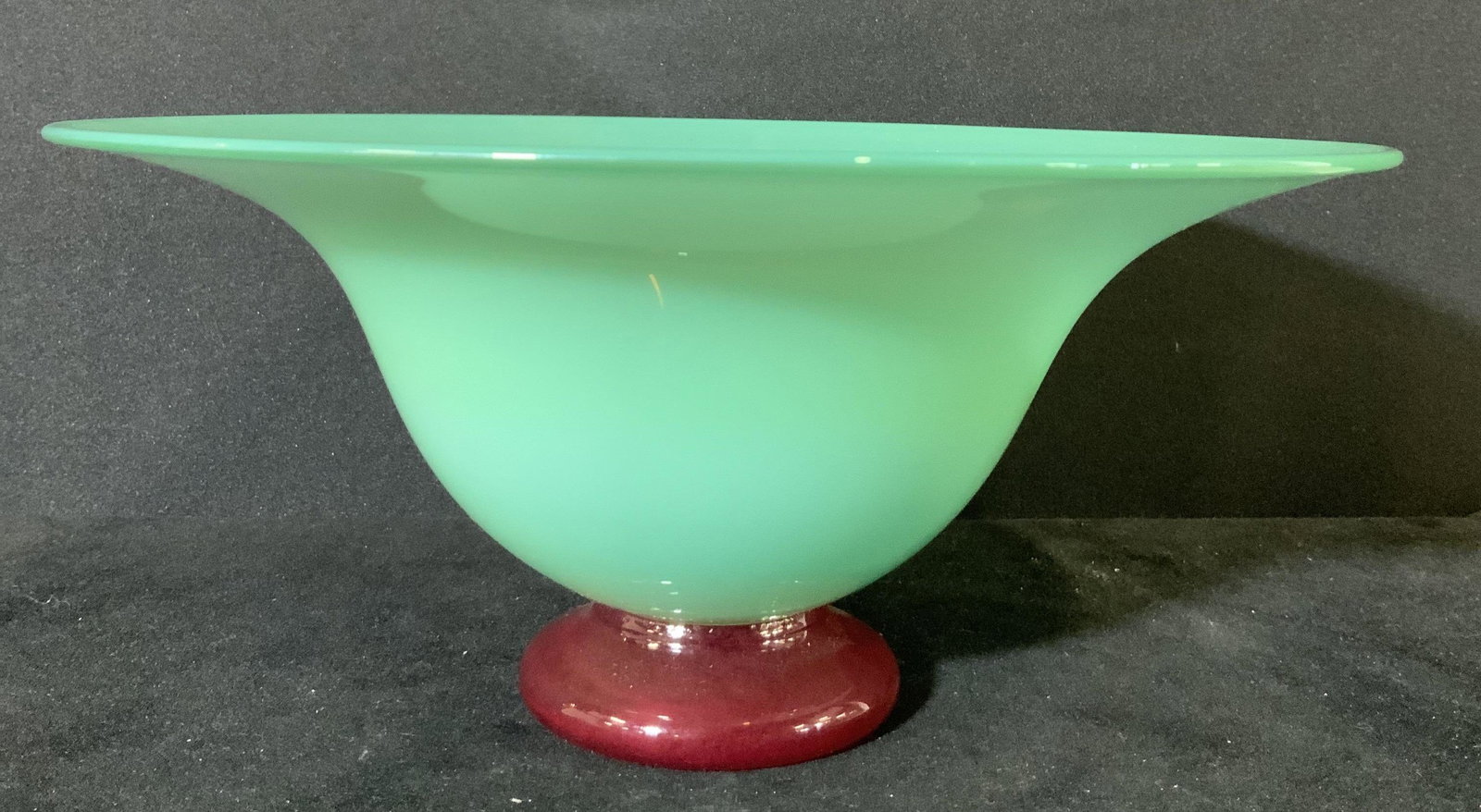 Handmade WILLA Signed Vintage Jadeite Glass Bowl: Jadeite colored art glass bowl. Underside of bowl features deep burgundy art glass foot. Underside signature is worn, appears to read: Willa A91. Underside also has pontil. Approx. Height 4 in. Approx