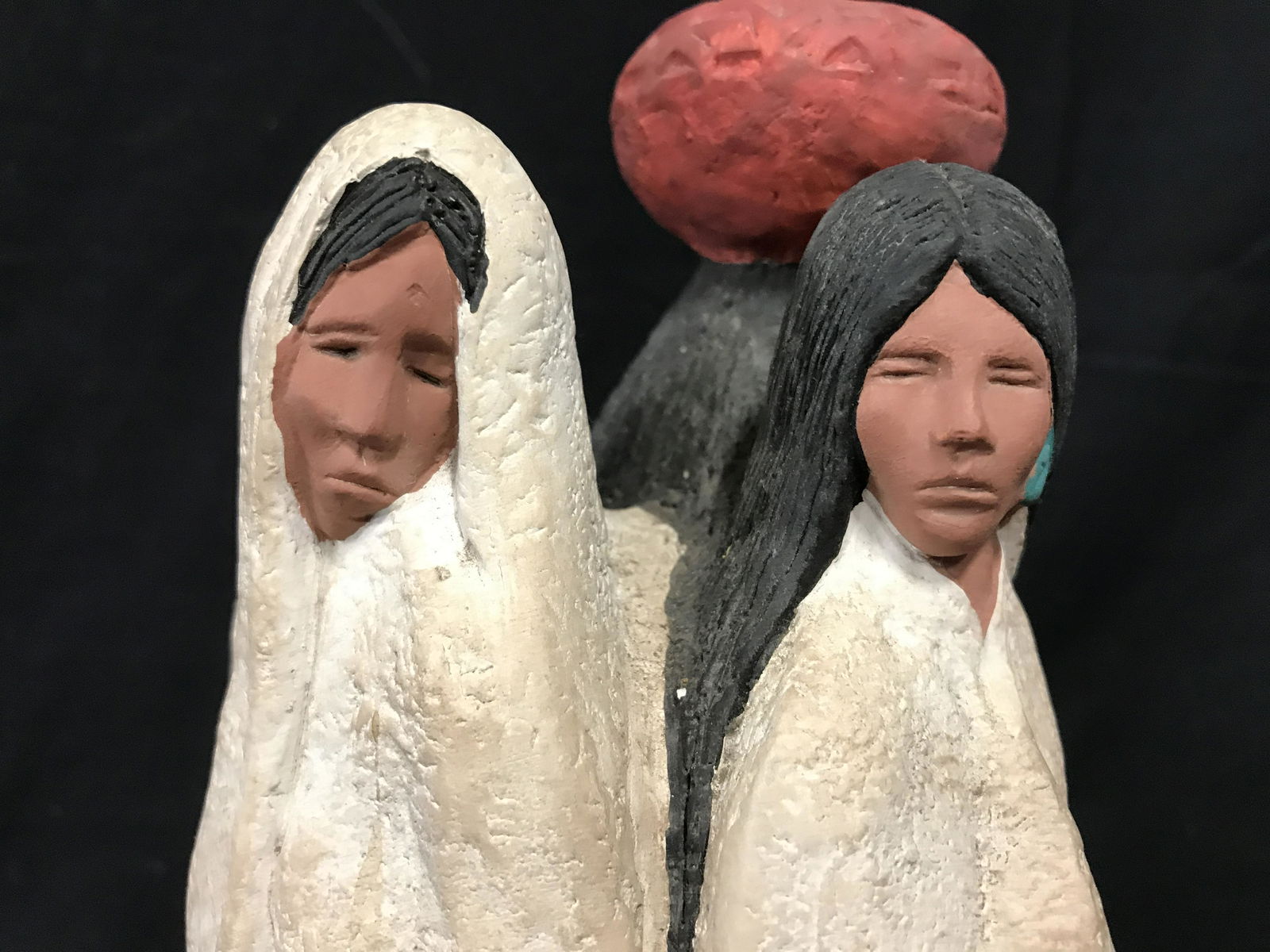 ACOMA AMERICAN CULTURE Southwestern Sculpture: Vintage, hand painted ceramic sculpture. Measures approx 14.25 inches H, and 6.5 inches W. Depicts three women, back to back, one with a vessel on their head, a vessel by their feet, and one is graspi