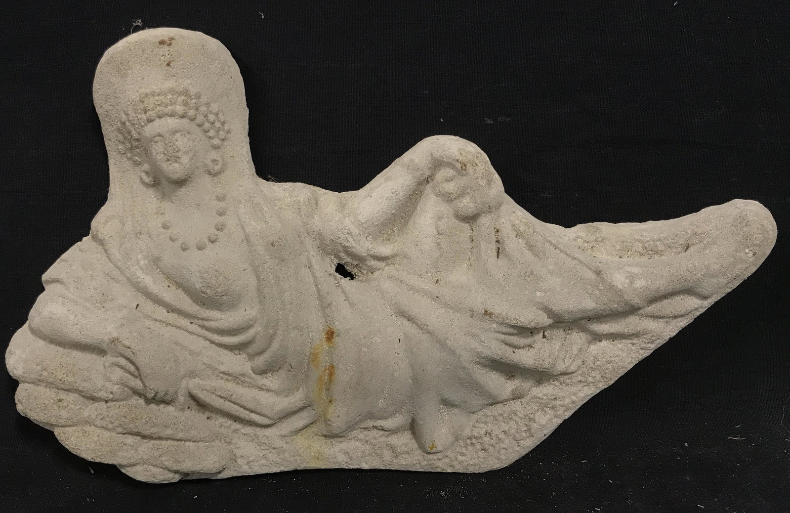 Balinese Reclining Female Figural Artwork: Balinese reclining female Figural artwork, no apparent signatures or stamps, subject a reclined female figure in Far East Asian attire with one breast exposed, carved in a relief type manor, Made of a