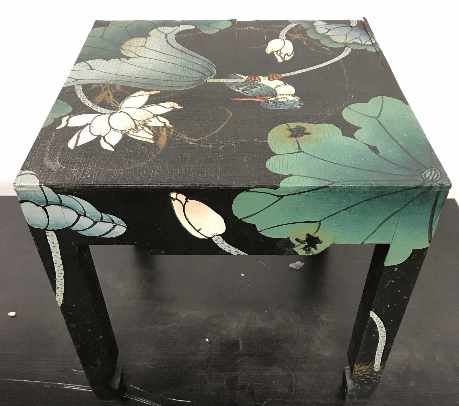 Vintage Painted Floral Detailed Footstool: Footstool is vintage & wooden. Piece appears to possibly be hand painted with multi toned floral leaf vine, & bird detail. Piece measures approximately 12 inches tall wide and deep. Footstool, vintage