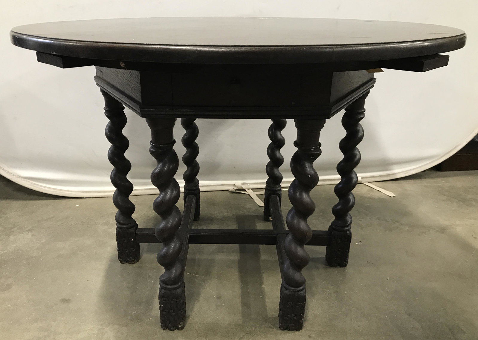Antique Wooden Barley Twist Leg Table: Table is antique and wooden. Piece appears to possibly be hand crafted. Table has 1 drawer with hand dovetailing and 4 pull out ash trays. Table has 6 Barley twist Style legs with stretchers in betwee