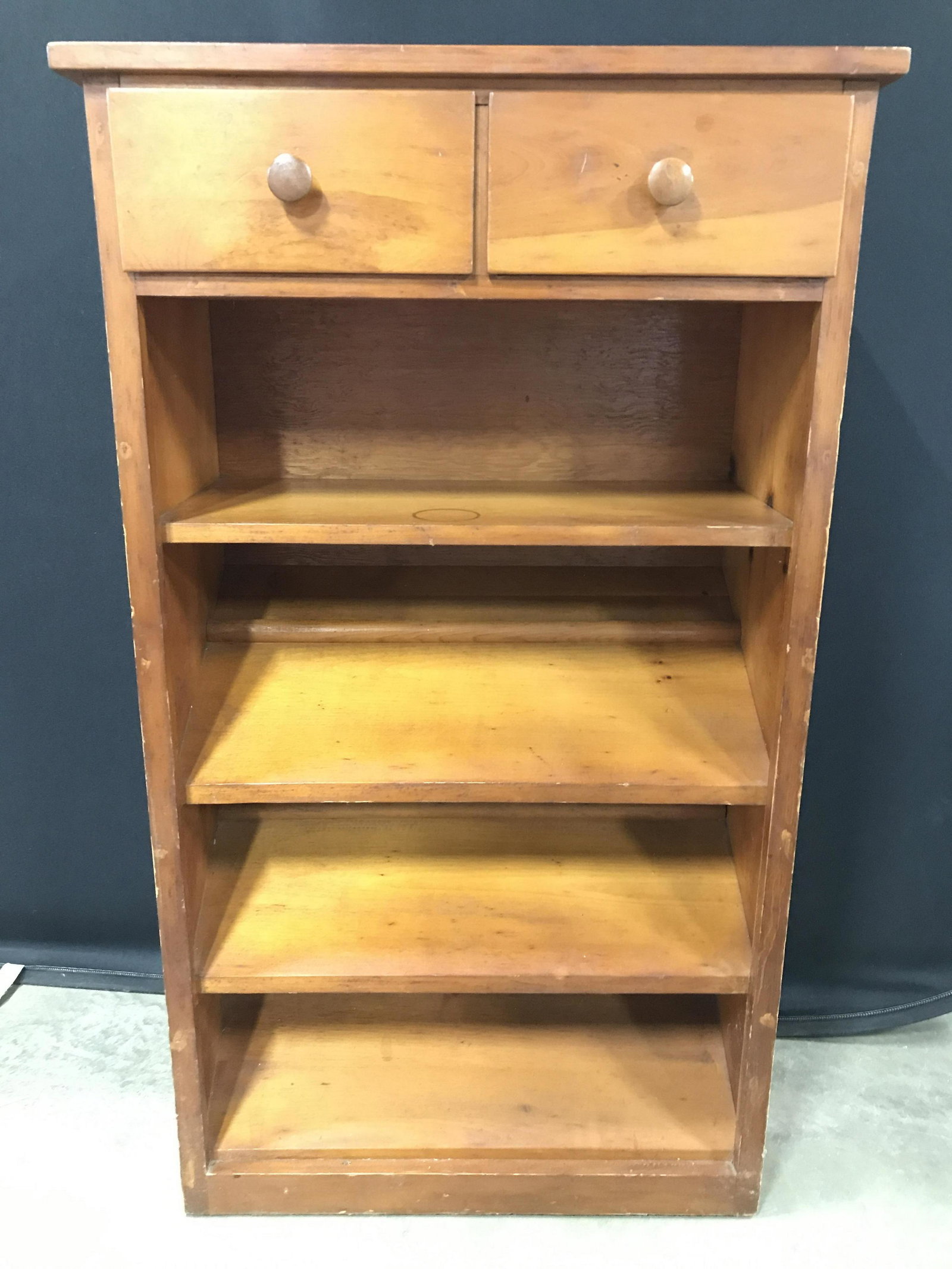 Vintage Carved Wooden Shelf W Drawers: Shelf is wooden. Piece has 1 level shelf & 2 slanted shelves. Top of piece has 2 drawers with wooden knob style handles. Piece measures approximately 47 inches tall 27 inches wide 13 inches deep. shel