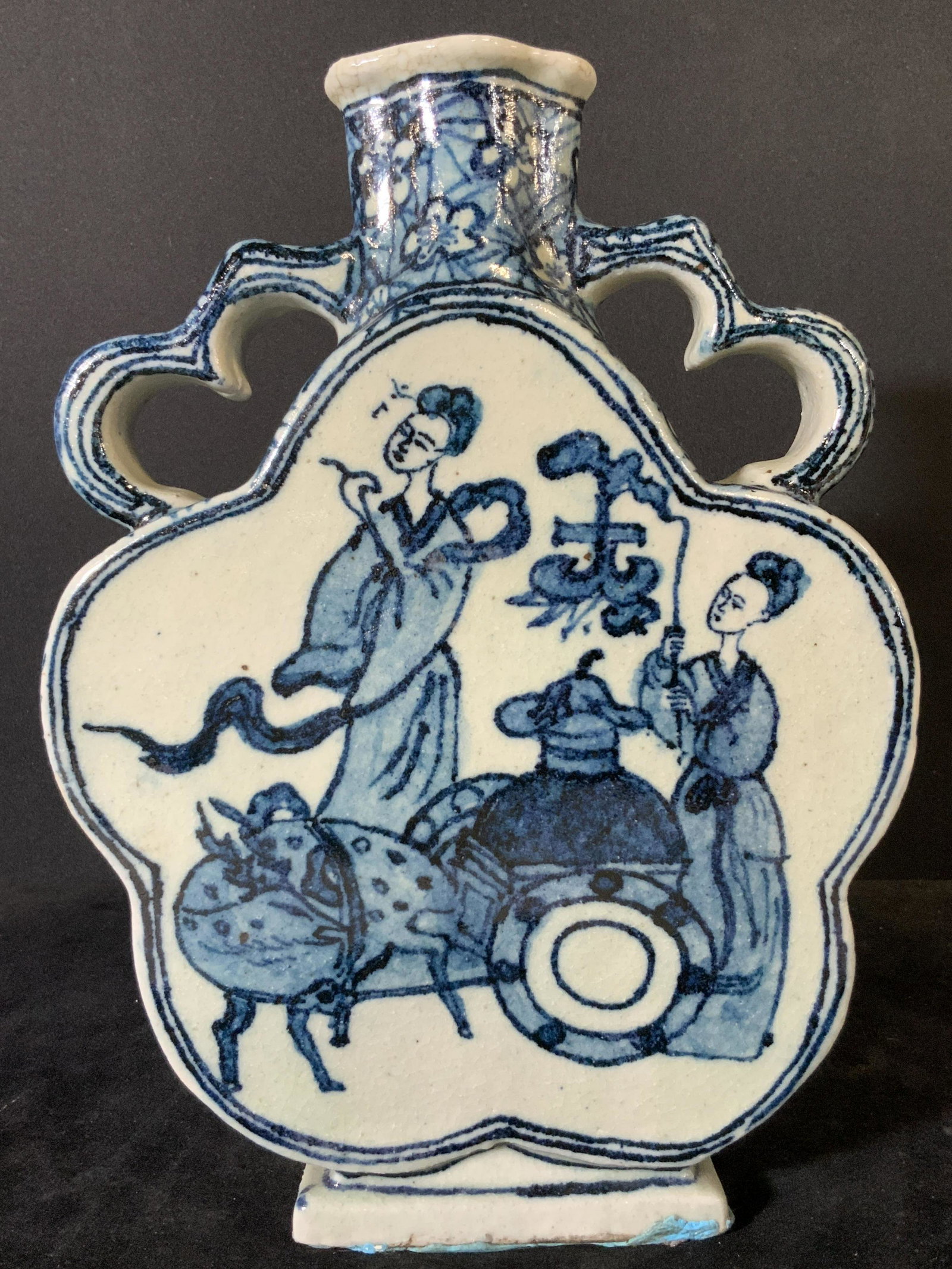 Antique Blue & White Porcelain Asian Moon Flask: An Asian porcelain moon flask vase. White porcelain with hand painted blue designs & glazed. Has decorative hand painted twin handles. The shape of the moon flask resembles a flower. The mouth of the
