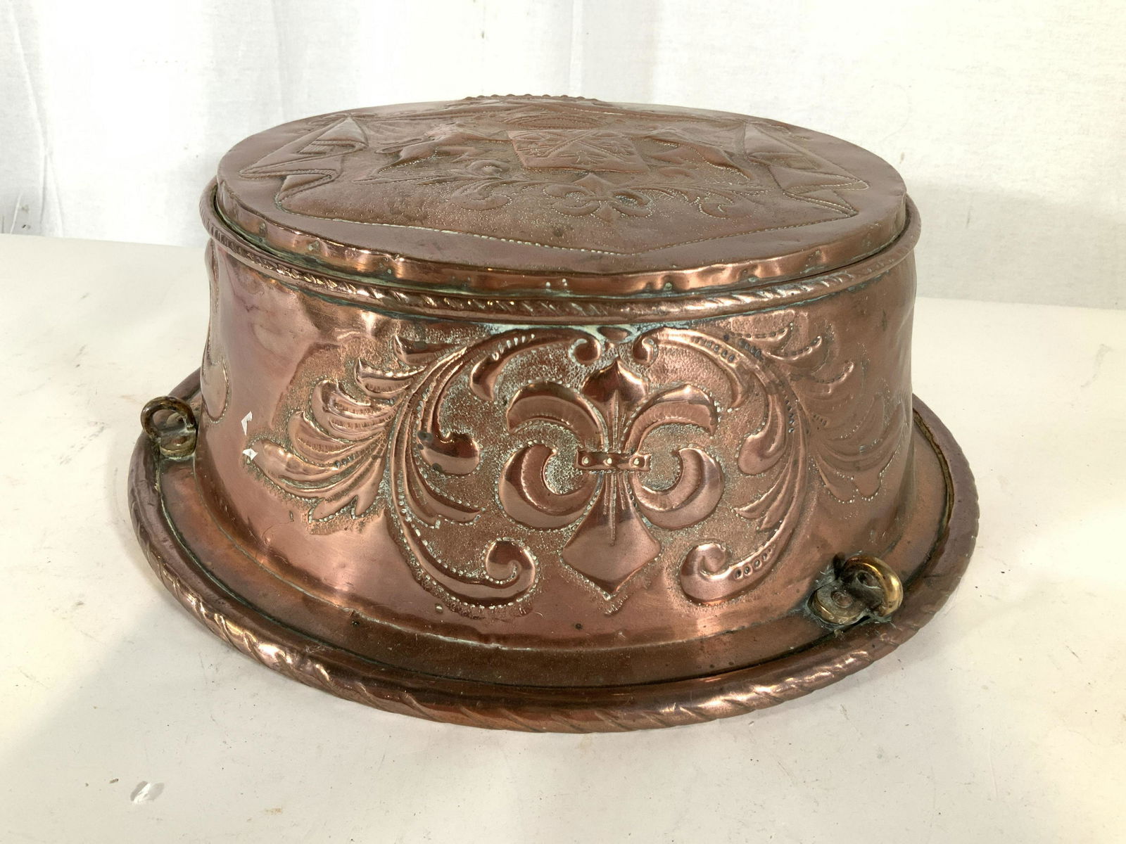 Large Antique Hand Chased Copper Pot: Designs of Fleur de lis, lions , crowns and shields possibly a family crest Hand chased and rope design trim, possibly English, copper pot, vessel, decorative object, English arts and crafts measures