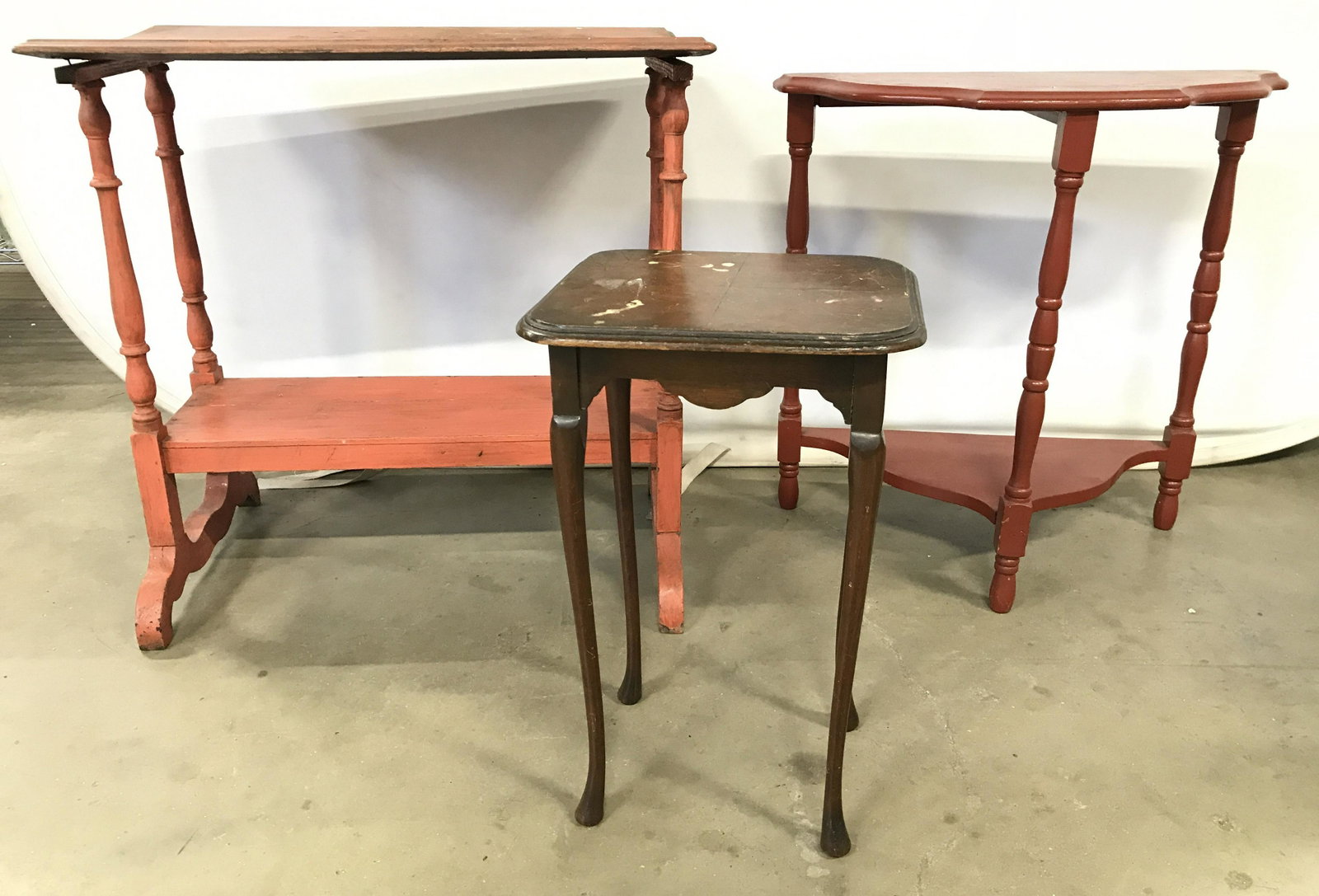 Lot 3 Antique Wooden Country Side Tables: Lot includes 3 side table. Each are antique and wooden. One table is brown toned with cabriole style legs. One table is red toned with Demilune shape. One table has rectangular shape with red tone. La
