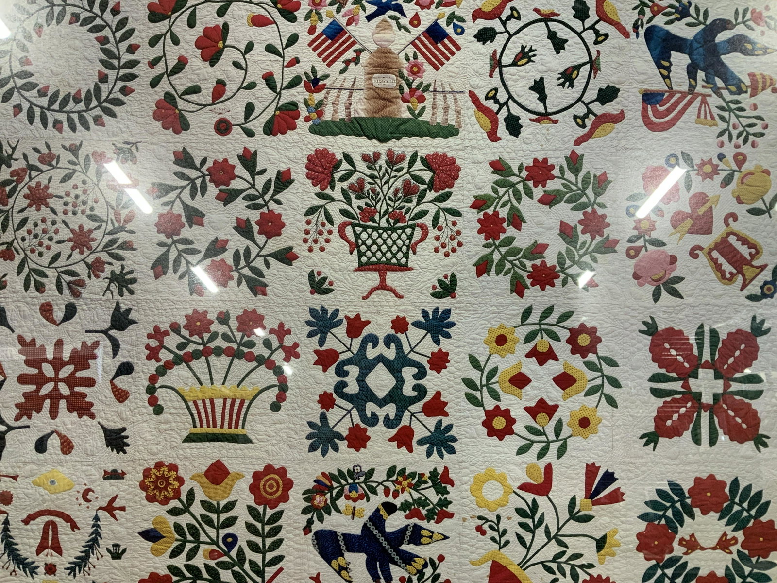 An American Sampler Folk Art Advertisement Print: An American Sampler Folk Art Offset Lithograph Advertisement, inscription reads ‘An American Samplers Folk Art from the Shelburne Museum National Gallery of Art, Washington 15 November 1987-14 April