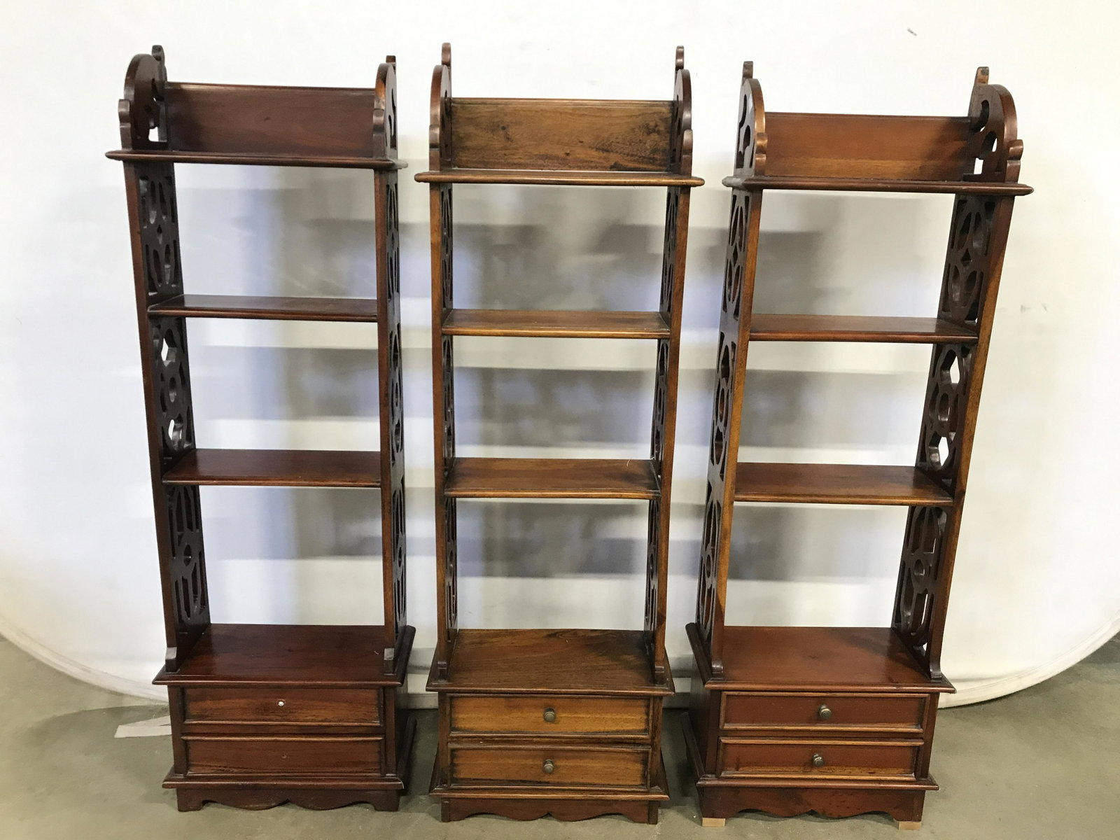 Lot 3 Antique Carved Wooden Bookshelves: Lot includes 3 bookshelves w drawers. Each have a light brown beige tone. Each have 2 shelf areas not including top. Bases of each piece have 2 drawers. Each drawer has hand dovetailing. Sides of each