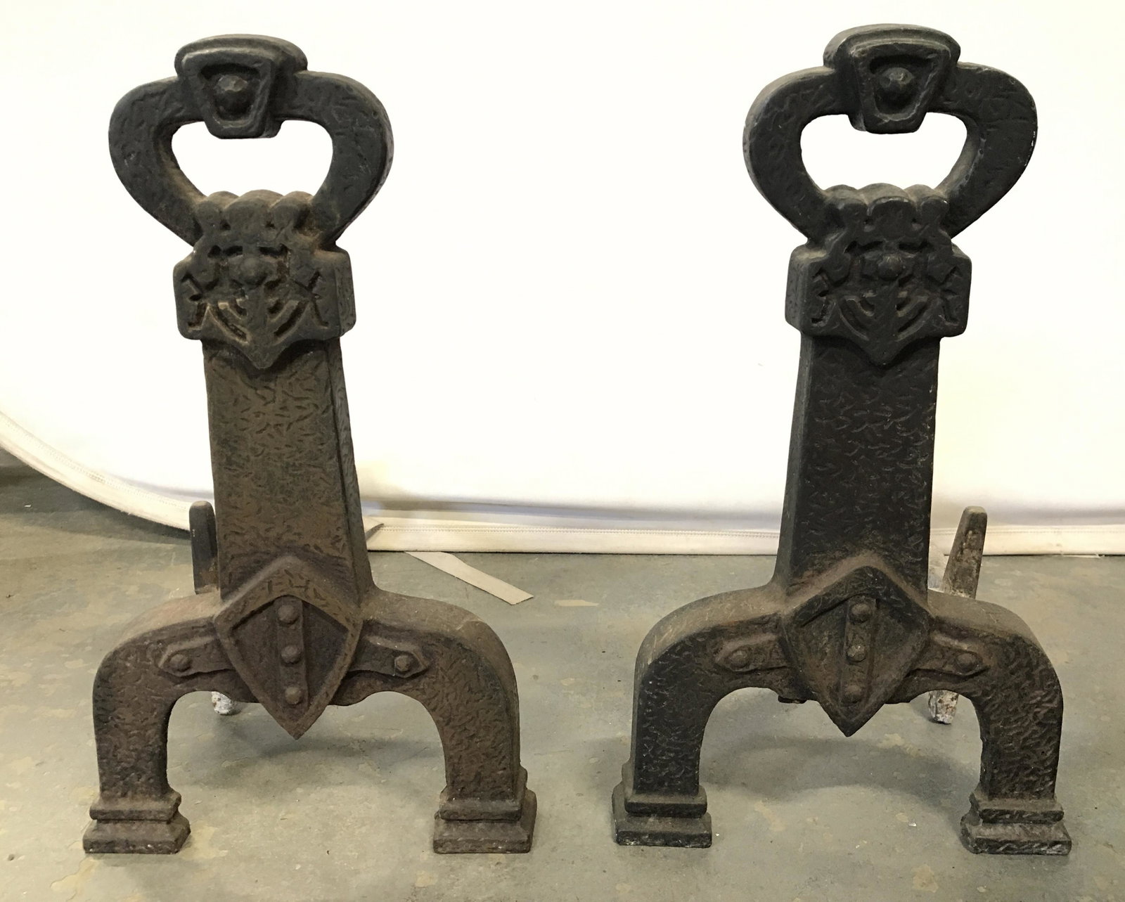 Pair Antique Metal Fireplace Andirons: Lot includes 2 andirons. Each are black toned and iron. Each measures approximately 18 inches tall and deep 11 inches wide. Fireplace tools, fireplace accessories, fireplace equipment, fireplace decor