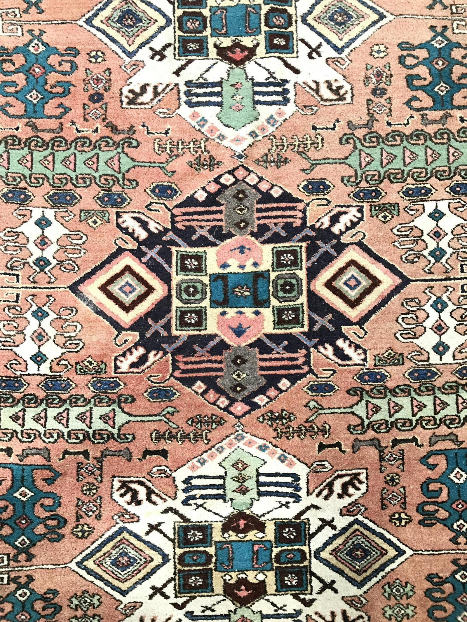 Vintage Handmade Fringed Wool Rug: Rug is vintage possibly antique. Piece is handmade and wool. Rug contains intricate multi toned geometric detail. Rug has fringes. Piece is possibly Turkish. Measures approximately 111 inches long 66 
