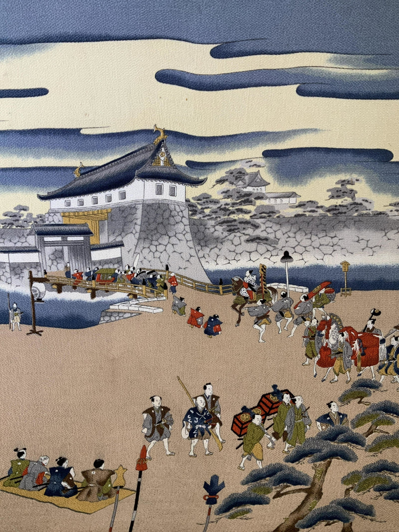 Edo Castle Lithograph on Fabric Artwork: Edo Castle Lithograph on Fabric on wood, no apparent inscriptions or signatures, subject a procession of people in front of a building, measures 25 5/8 x 22 inches, not framed, Property of Janine Metz
