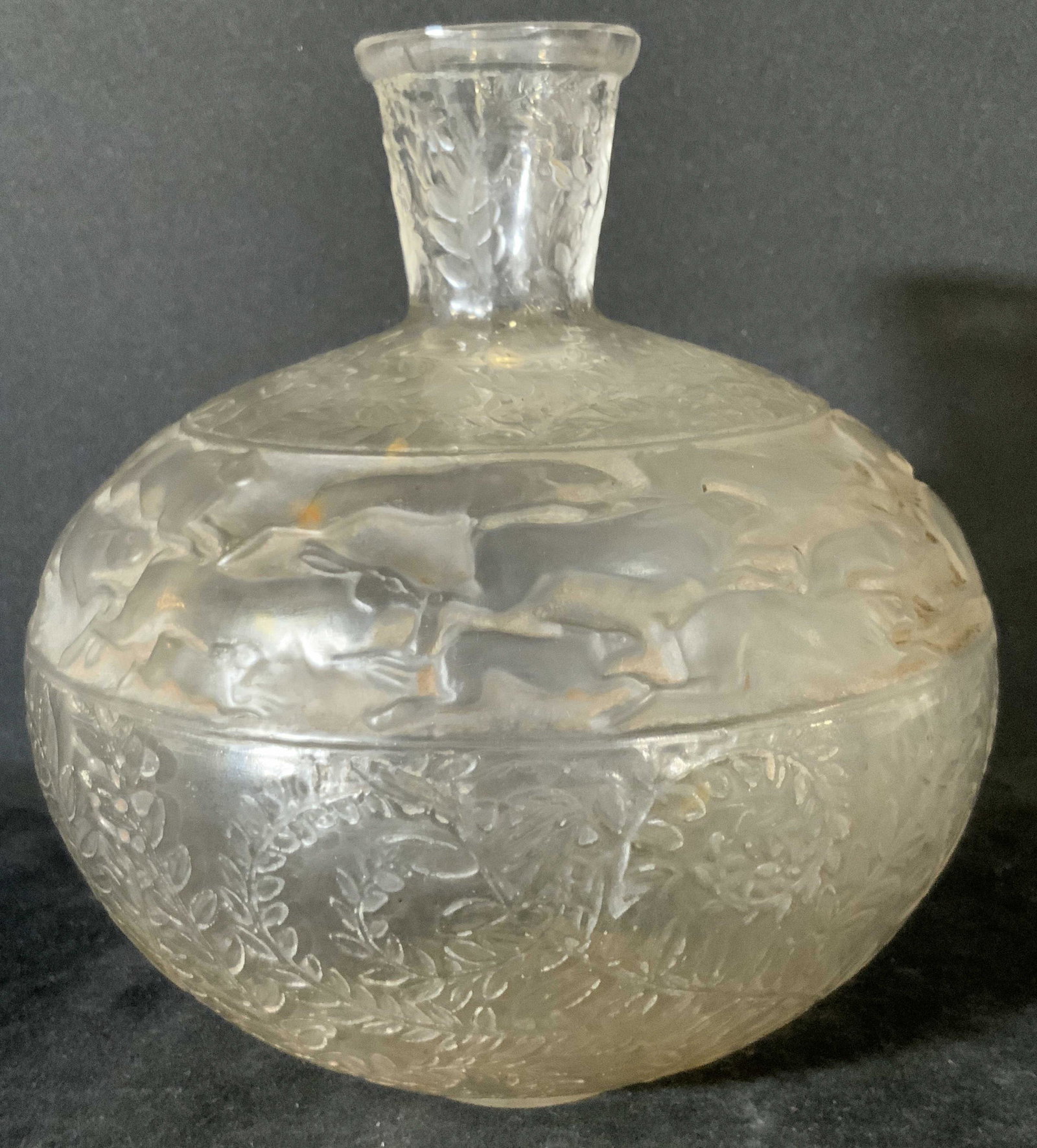 LALIQUE Antique Signed Lievres Art Glass Vase: Circa 1920s signed Lalique vase. The form is a slightly compressed globular shape. Short, flared neck. Frosted, colorless glass. Relief of band of wild hares running contained within two other section