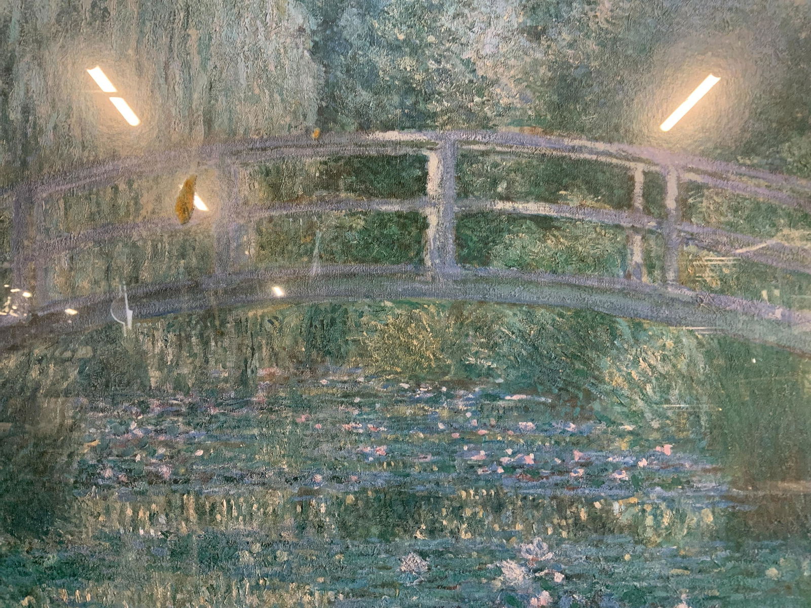 CLAUDE MONET Bassin Aux Nymphes Offset Lithograph: CLAUDE MONET Bassin Aux Nymphes Offset Lithograph, inscription to piece reads ‘Claude Monet Bassin Aux Nymphes’, subject a bridge over a pond, measures 23 3/4 x 19 7/8 inches, gold toned metal fra