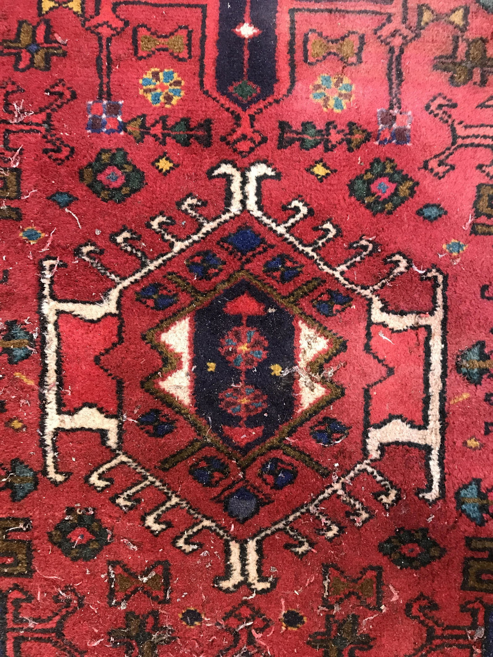 Antique Handmade Wool Runner: Rug is wool and handmade. Piece is vintage possibly antique. Rug contains intricate multi toned geometric detail. Piece measures approximately 107 inches long 32 inches wide. Rug, carpet, area rug, wo