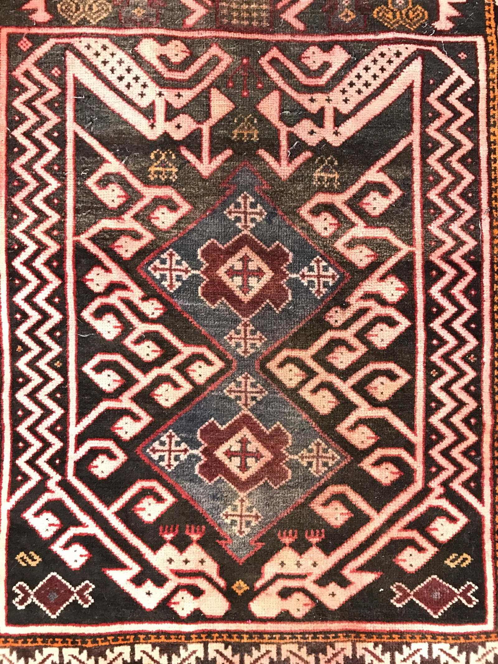 Handmade Antique Turkish Fringed Wool Rug: Rug is handmade and wool. Piece is vintage possibly antique. Rug appears to be Turkish. Rug contains multi toned geometric detail. Rug has fringes. Piece measures approximately 60 inches long 33 inche