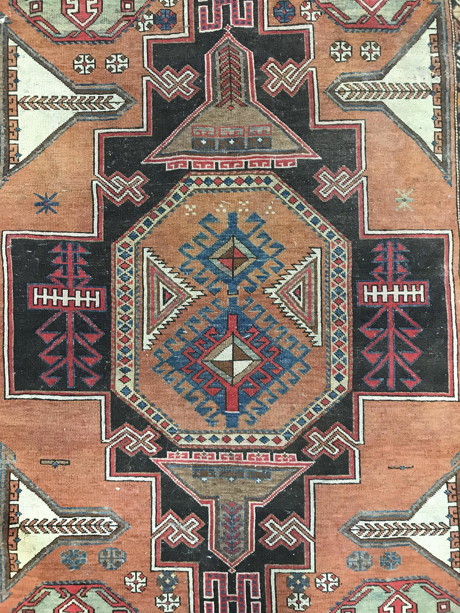 Handmade Antique Turkish Fringed Wool Rug: Rug is handmade and wool. Piece is vintage possibly antique. Rug appears to be Turkish. Rug contains multi toned geometric detail. Rug has fringes. Piece measures approximately 71 inches long 48 inche