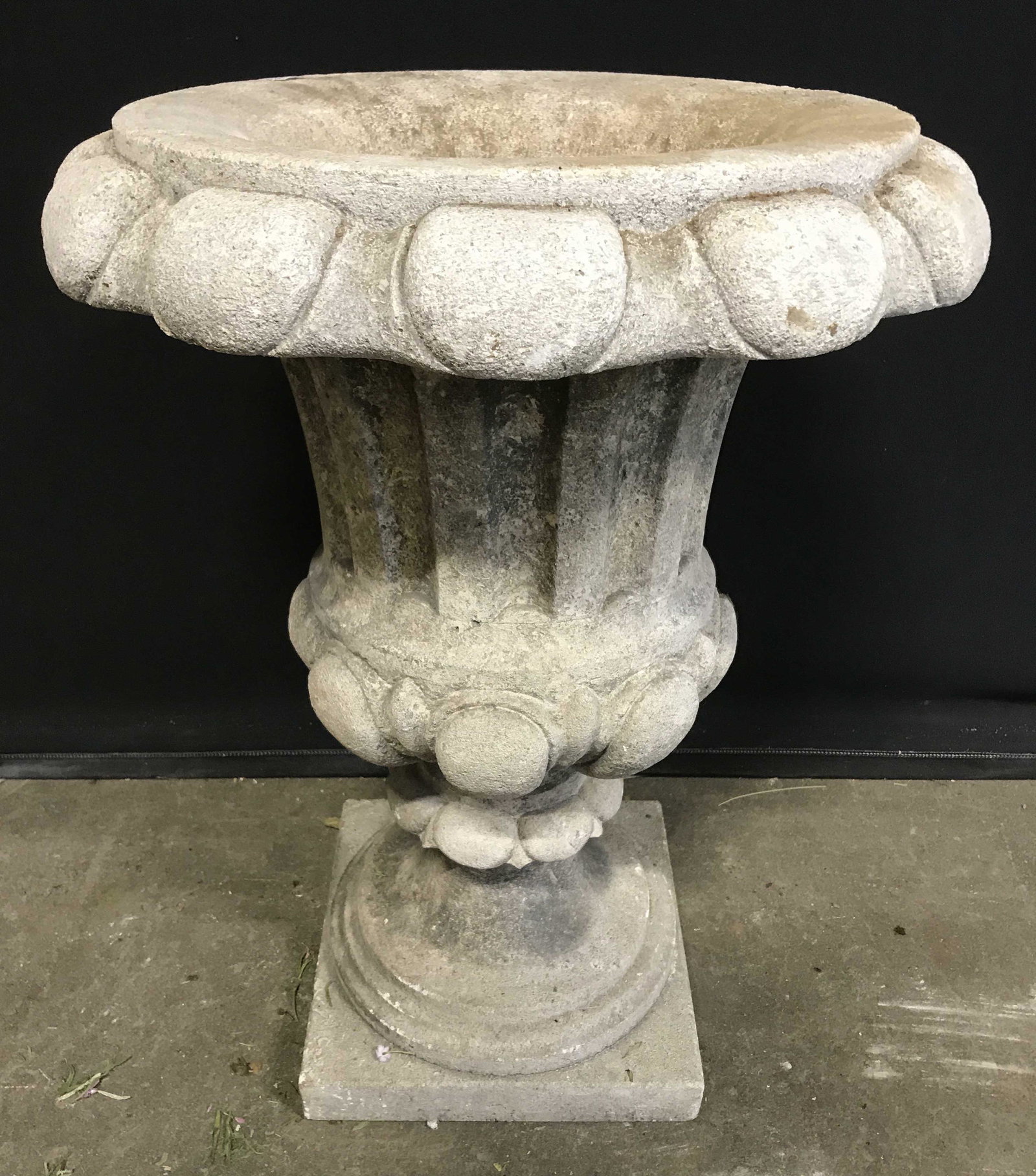 Vintage Stone Garden Urn Planter 25 in H: Vintage stone planter. Vessel can separate from column, needs reattachment. Measures approx 25 inches H, 18.5 inches in diameter. Wear is consistent with age and exposure. Urn, cement urn, outdoor urn