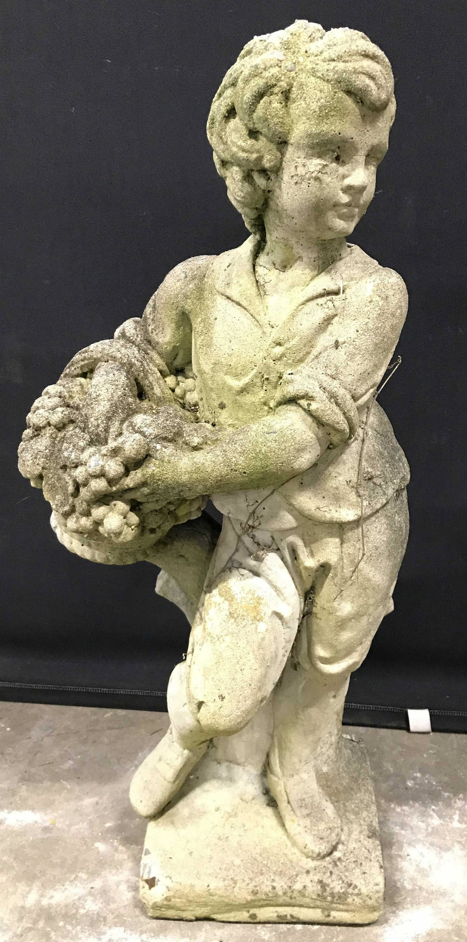 Vintage Cement Child Figure Garden Statuary 30in H: Garden Statuary is cement, appears to be vintage. Piece depicts a standing child figure holding a basket of flowers. Piece measures approximately 30 inches tall 14 inches wide 10 inches deep. Garden S
