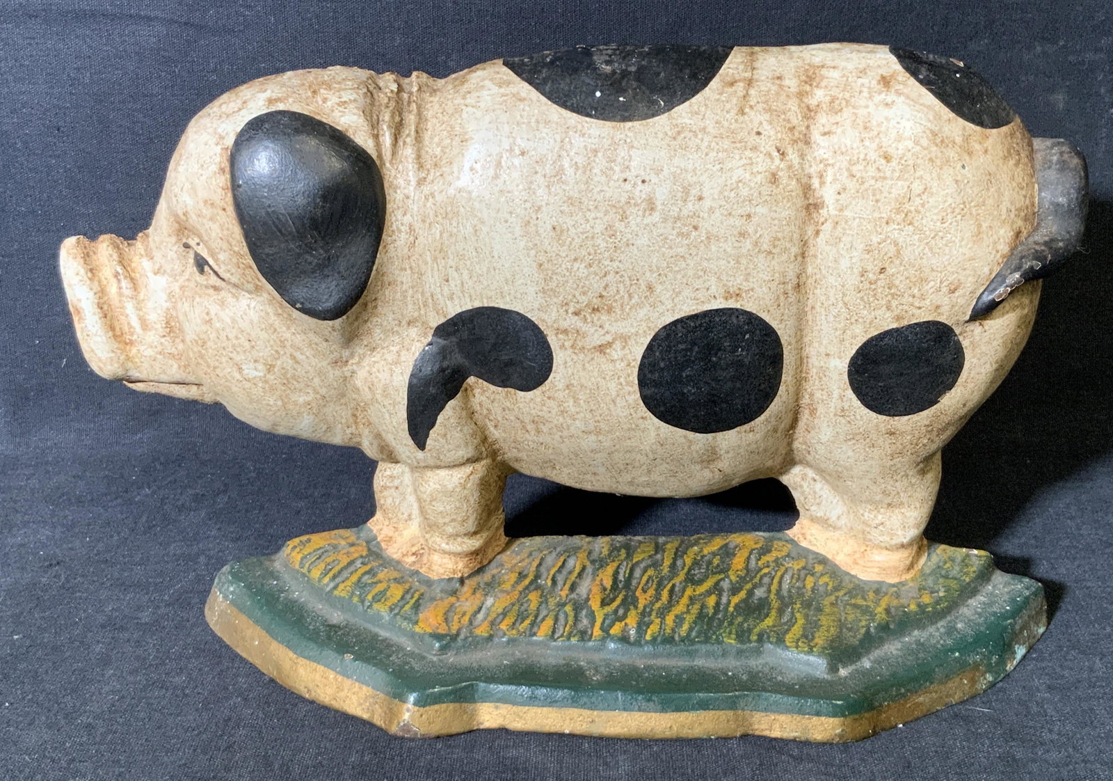 Vintage Hand Painted Cast Iron Pig Door Stop: Vintage Hand Painted Cast Iron Pig Door Stop, vintage possibly antique, no apparent inscriptions or signatures, subject a white pig with black spots standing atop a green and yellow field, some chips 