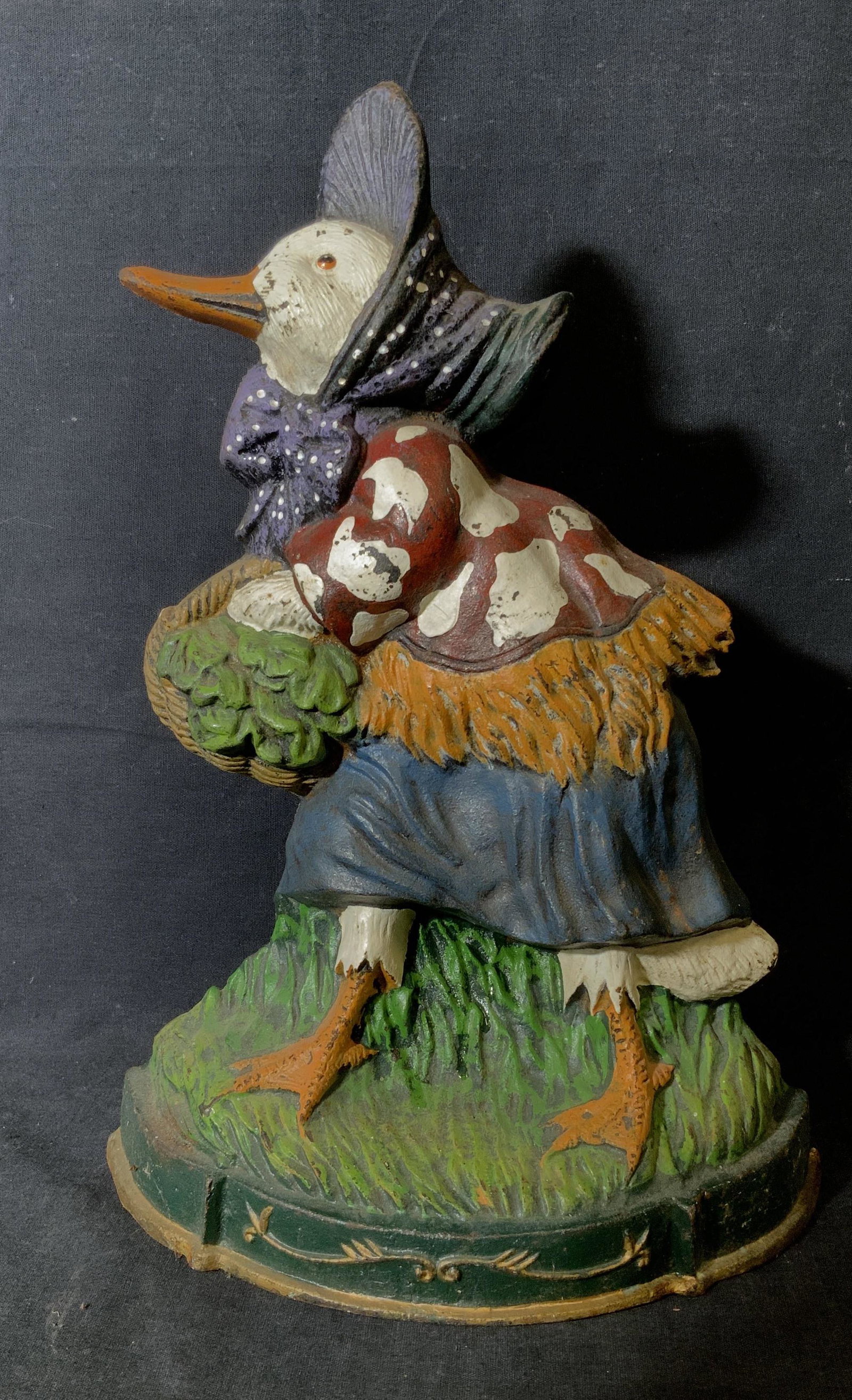 Vintage Hand Painted Cast Iron Goose Door Stop: Vintage Hand Painted Cast Iron Goose Door Stop, vintage possibly antique, no apparent inscriptions or signatures, subject a white goose in a dress shawl and hat carrying a basket of veggies, some chip