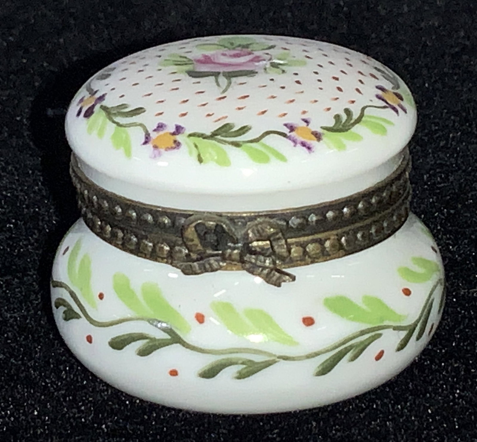 FRENCH SEVRES HAND PAINTED Snuff Pill Box: Hallmarked porcelain box, mark on verso in blue ink under glaze of porcelain. Possibly Sevres. Mark unidentifiable. Hand painted with single pink rose and flower wreath on lid, laurel design on sides.