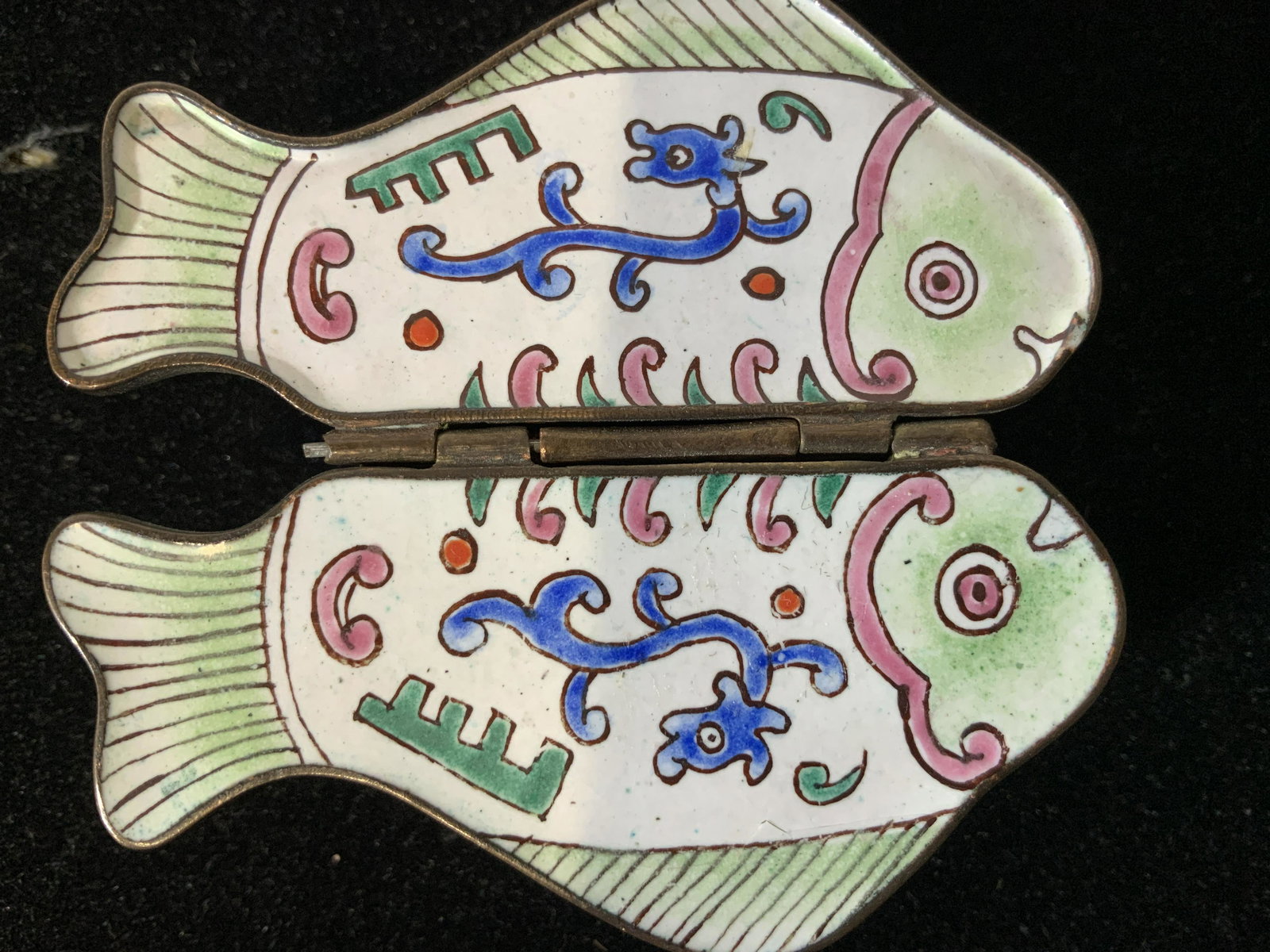 Lot 2 ASIAN ENAMELED METAL PILL BOXES, China: Adorable PANDA hounding ball on one box. Removable lid. Etched floral design. Hallmarked on sticker ‘ Made in China’, 2.5 x 2 x 1.5 in. Double hinged FISH box. Flaps open to reveal compartment on 