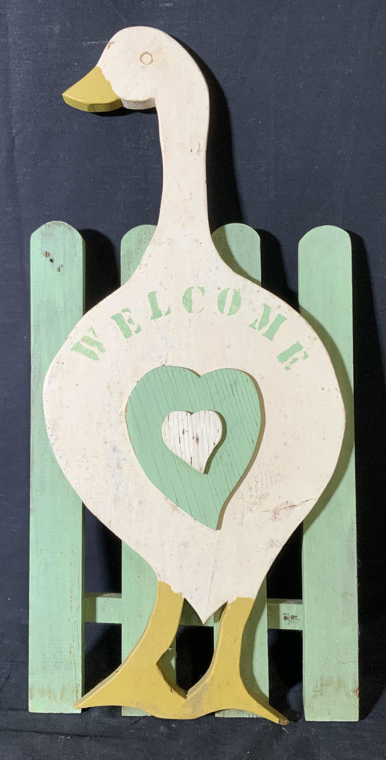 Vintage Folk Art Wooden Goose Garden Sign: Vintage Folk art wooden goose garden sign, vintage possibly antique, hand painted wooden sign, no apparent inscriptions or stamps, subject a goose standing in front of a green fence with hearts on its
