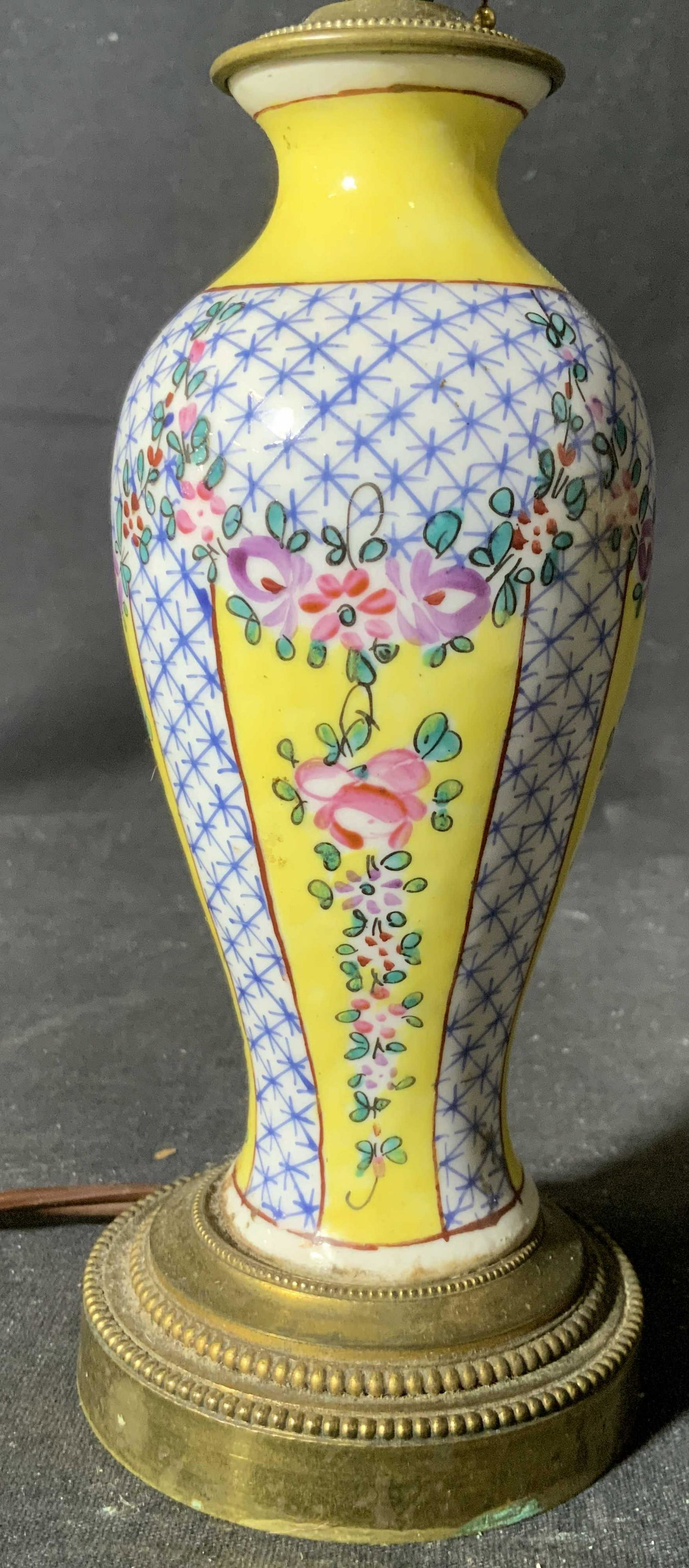 Vintage Hand Painted French Porcelain Lamp: Underside of piece is marked FRANCE Lamp is hand painted. Piece is vintage possibly antique. Lamp contains intricate floral, leaf, and geometric pattern detail. Base is gold toned and appears to possi