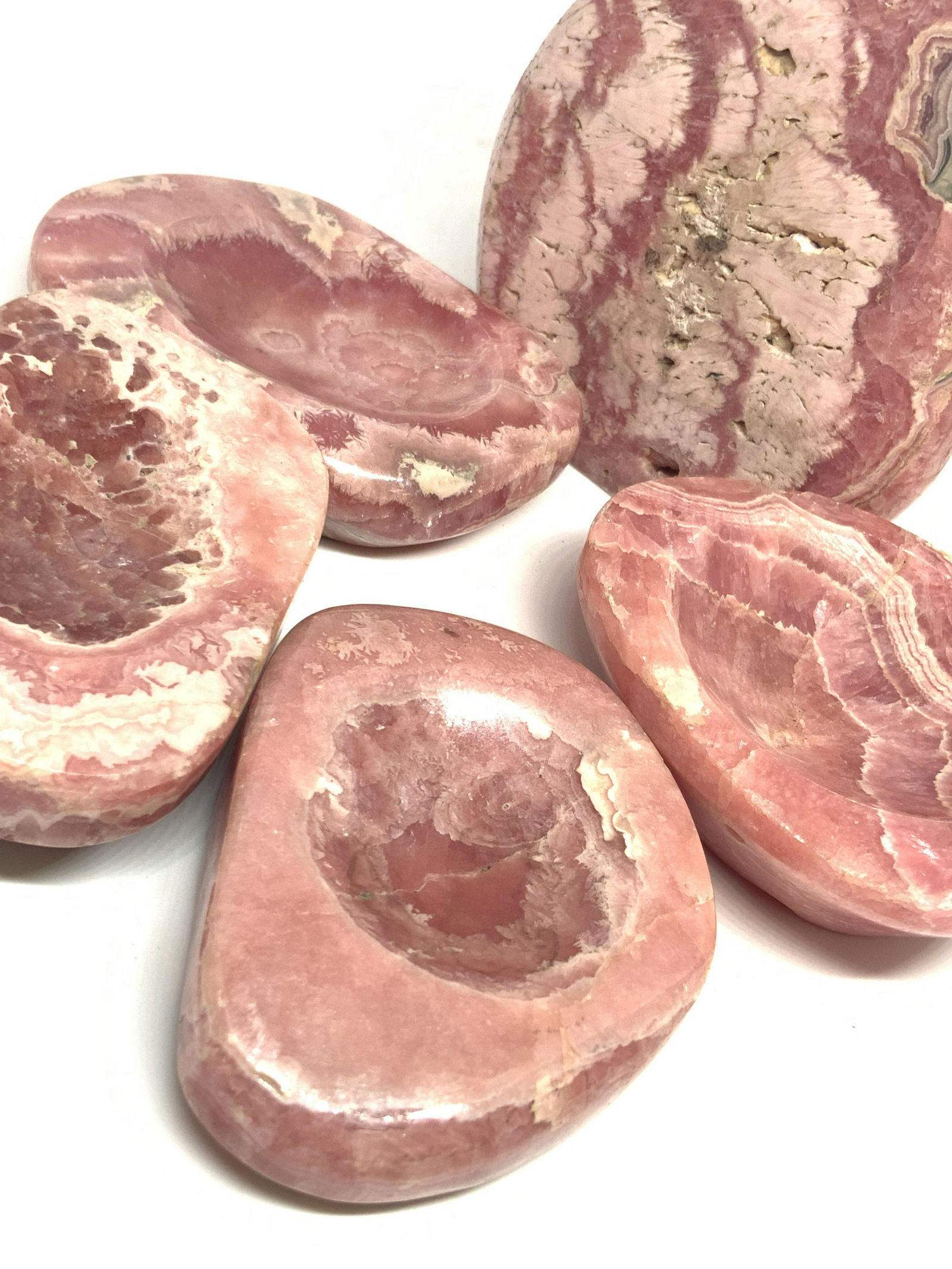 Group 5 Polished PINK MARBLE Stone Trinket Dishes: Five polished pink marble stone trinket dishes and decorative objects. Four of the polished pink marble pieces are crafted with a circular dip in the center meant for holding trinkets or keepsakes. Th