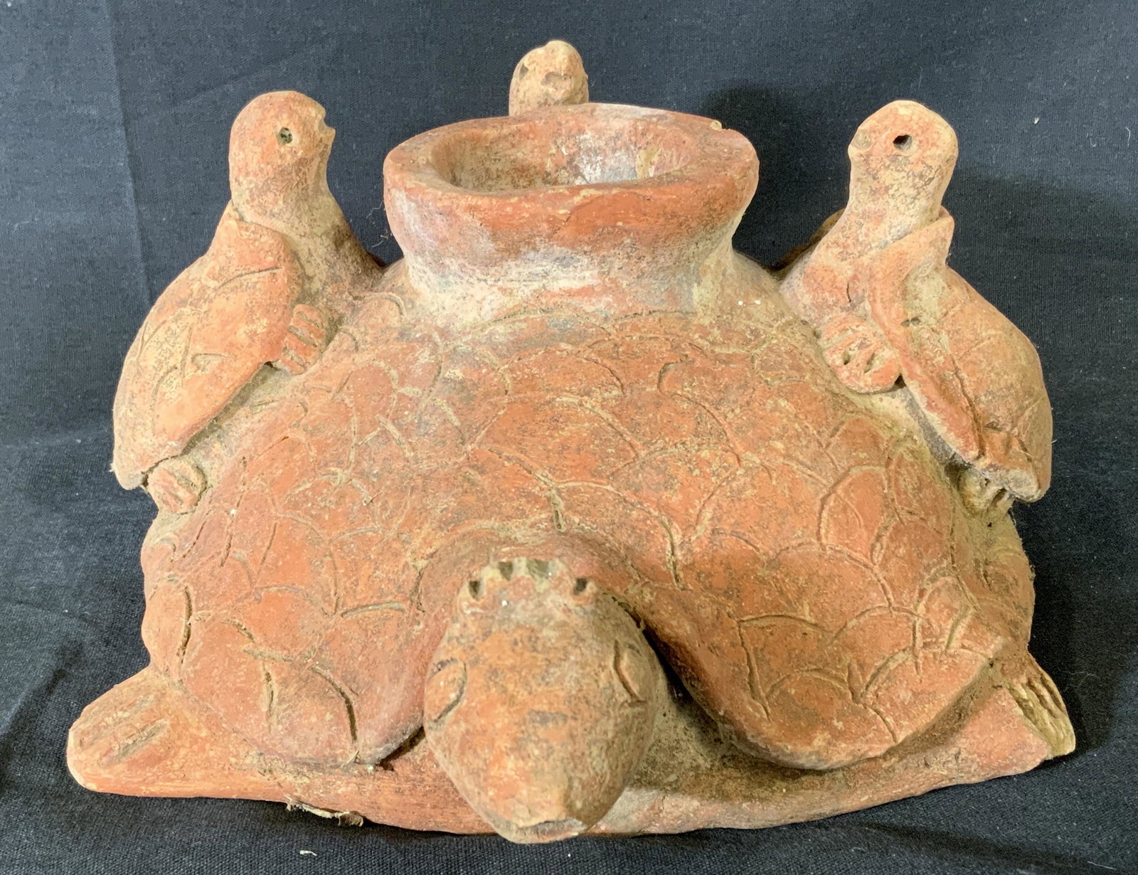 Vintage Earthenware Tortoise Vase: Vintage zoomorphic tortoise vase. Resembles a tortoise with several smaller tortoises on its back. Measures approx 4.5 inches H, and 10.5 inches W. Property of Janine Metz Social Secretary to the Duke