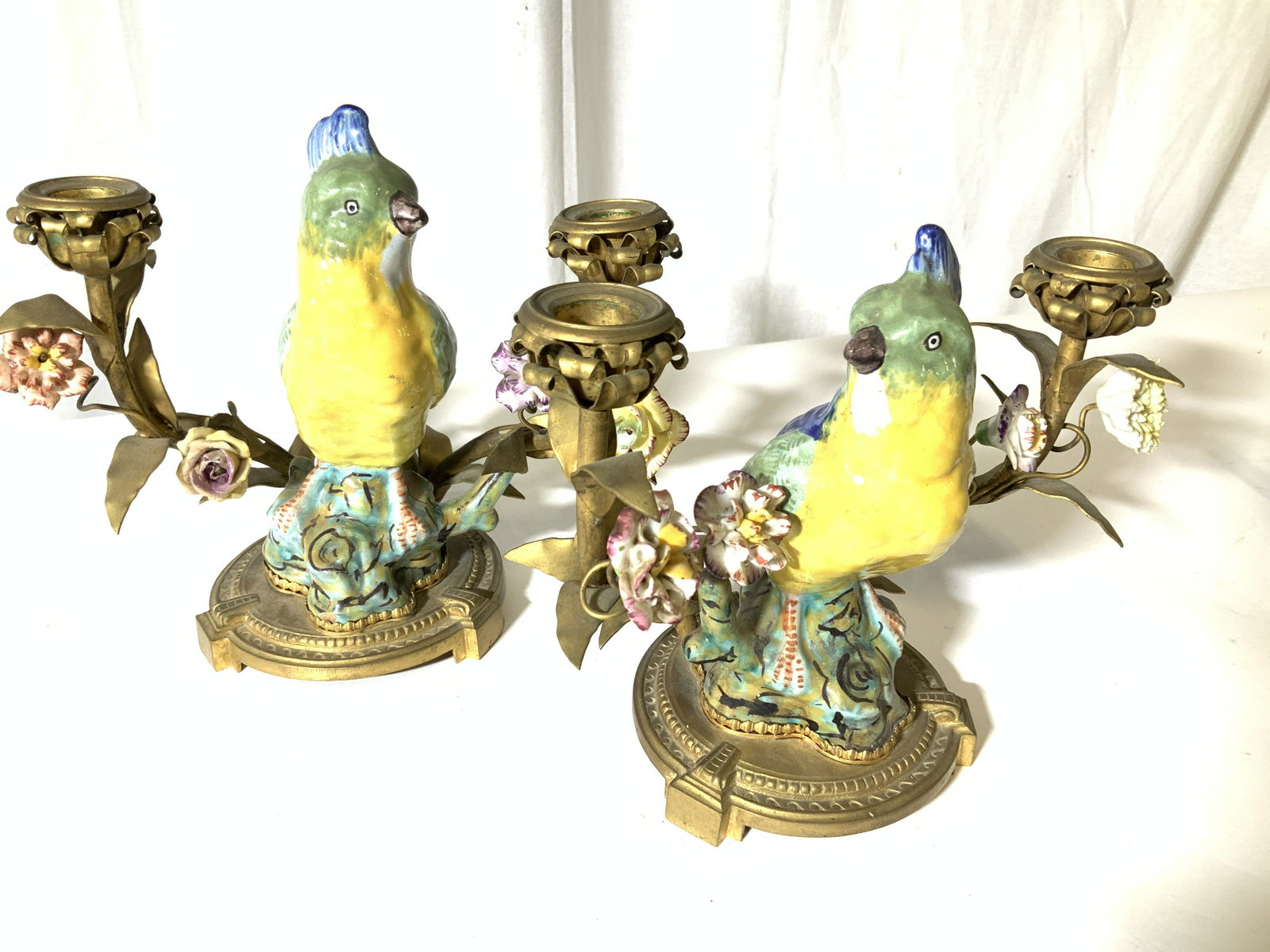Pr Signed antique French Ceramic Bird Candelabras: France Pair antique gilt metal painted porcelain candelabras, each candelabra has two arm candleholders in gilt bronze and gilt metal branch and leaf form, open flowers as candle holders, center part 
