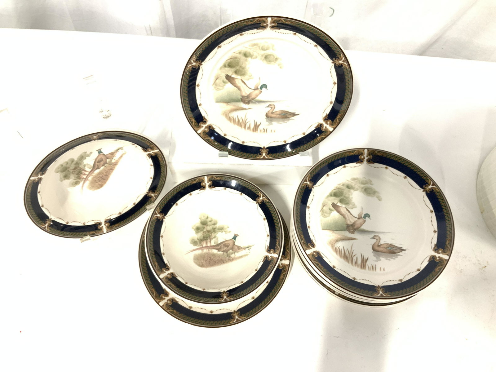 Set 10 KELTCRAFT by Noritake Stoneware: Set of 8 plates and 2 bowls, bird/ waterfowl motif. Hallmarked Keltcraft Ireland 9188 Tranquil Glen designed by Noritake, with either pheasant or mallard duck motif. Plates 8 in. Bowls, 7 x 2 in. Iris