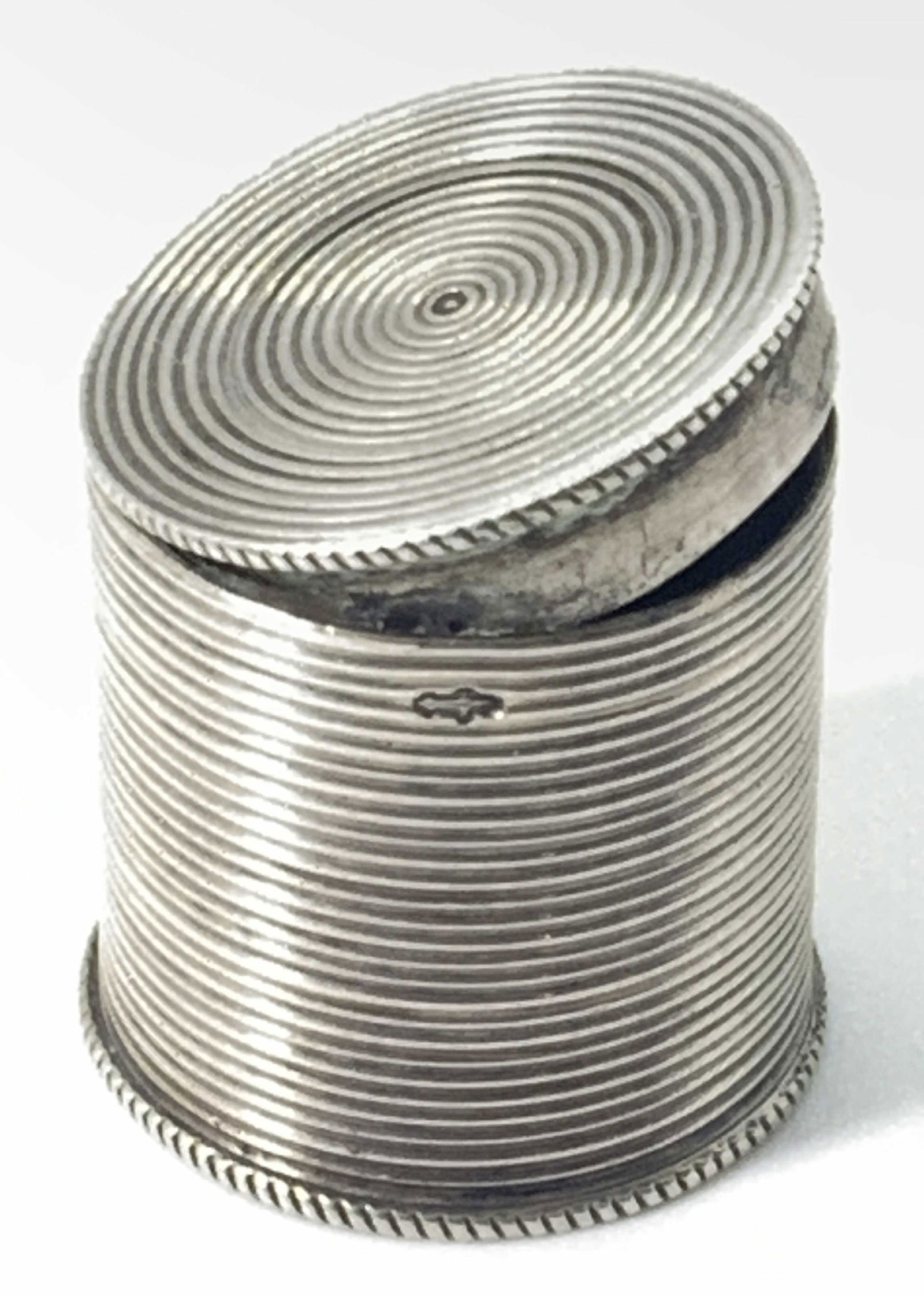 Antique Dutch Sterling Silver Lidded Pill Box: Antique Dutch Sterling Silver Lidded Pill Box. 3/4 in tall and wide.Illegible hallmarks on upper rim of body and on lid rim. Some discoloration on interior. Property of Janine Metz estate, social secr