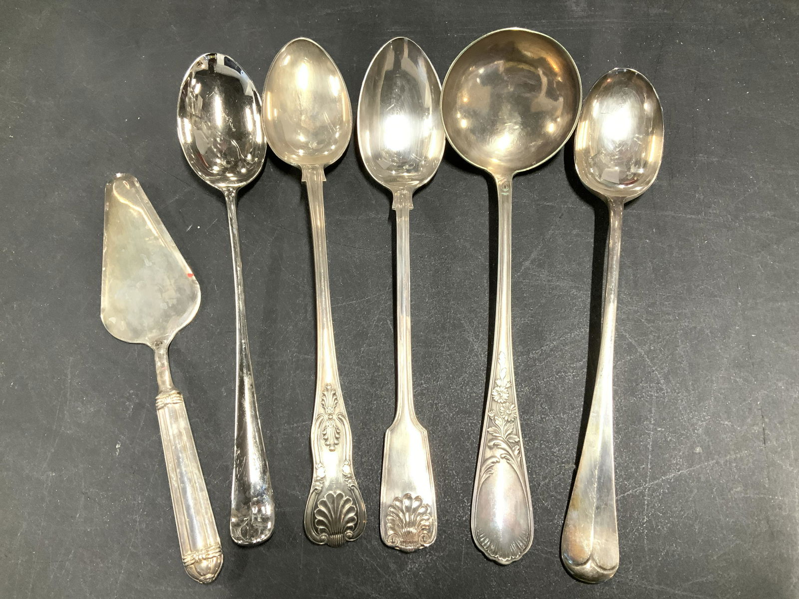 Lot 6 Silver toned metal Serving utensils: Hallmarked Modern+Vintage Large specialty serving utensils- ladle 12.5 in. L, pie server, large buffet spoons 13 in. Most are Hallmarked pieces, makers include EL ENGLAND, F.B. ROGERS, W&D, A (ITALY).