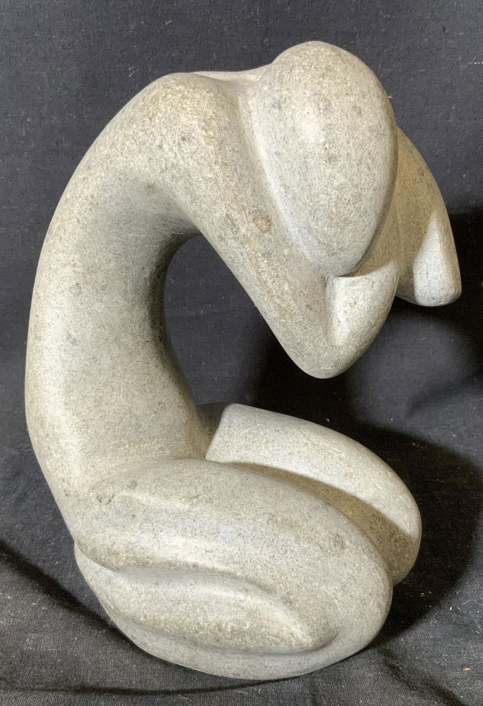Initialed Minimalist Stone Statue: Initialed minimalist stone statue, initials to side read ‘J R’, subject a human figure kneeling and crouched over with hands to the back of its head, piece made of a grey stone, measures 8 inches