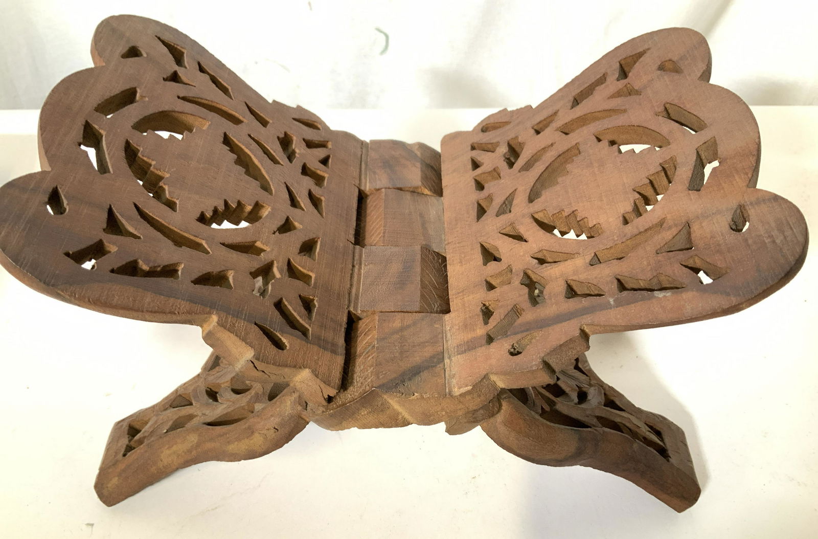 Carved Wooden ‘X’ Book Stand, Holy Book Stand: This is a Handcrafted wooden folding bible, bhagwat geeta book or other holy book stand with carving in traditional design. Opens like an ‘X’ and can hold any favorite book, easily folds flat. Ope