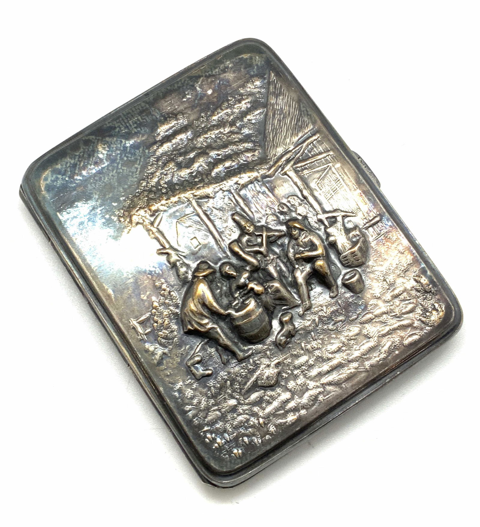 Antique Swedish Silver Plated Cigarette Case: Circa 1900s Antique Swedish silver plated cigarette case. Once used for storing cigarettes. Can be used for storing trinkets, keepsakes, change, and more. Etched and embossed metalwork. Embossed cente