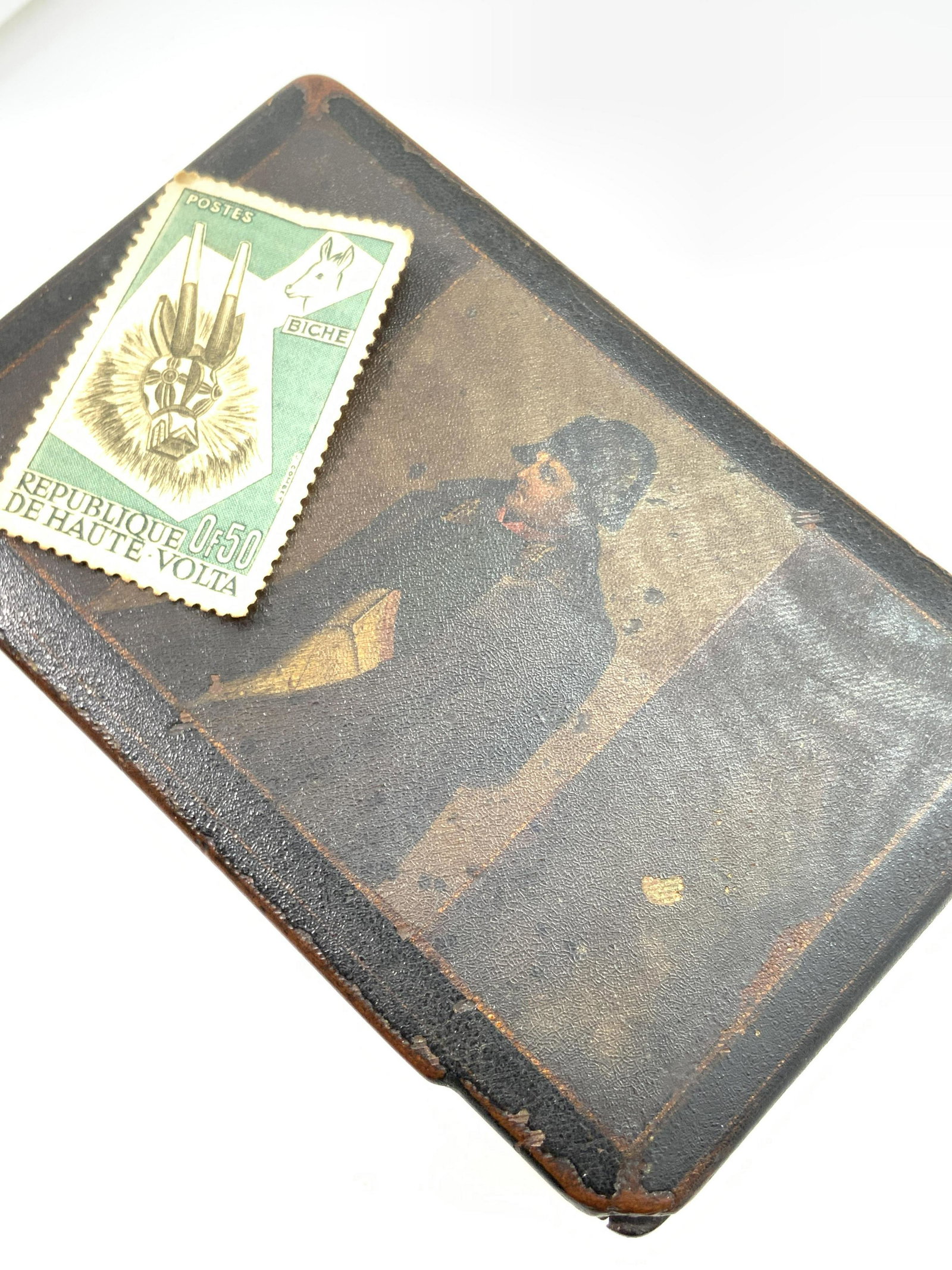 Antique Hand Painted NAPOLEON Wooden Trinket Box: An antique wooden trinket box with a hand painted portrait of Napoleon Bonaparte on the lid. Napoleon is depicted wearing a hat, a coat, and his iconic uniform. A type of glaze covers the portrait. Th