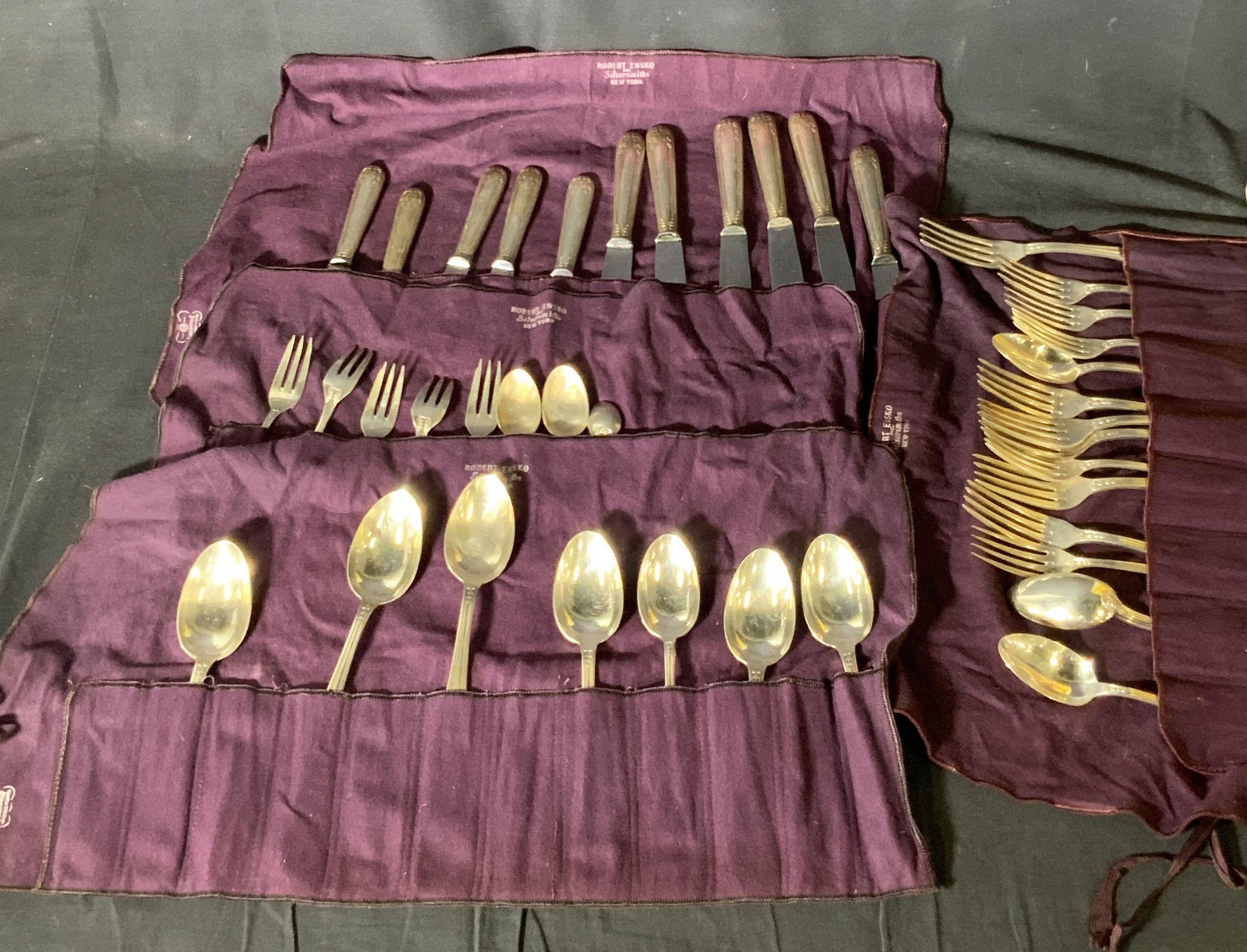 Lot40 Antique French SP Silverware Utensils W Bags: Lot 41 pieces of silver plated knives, forks, and spoons. Pieces range from being antique to vintage, circa 1900s and on. 11 butter knives signed: BACKER BRUXELLES. 15 forks, hallmarks on the undersid