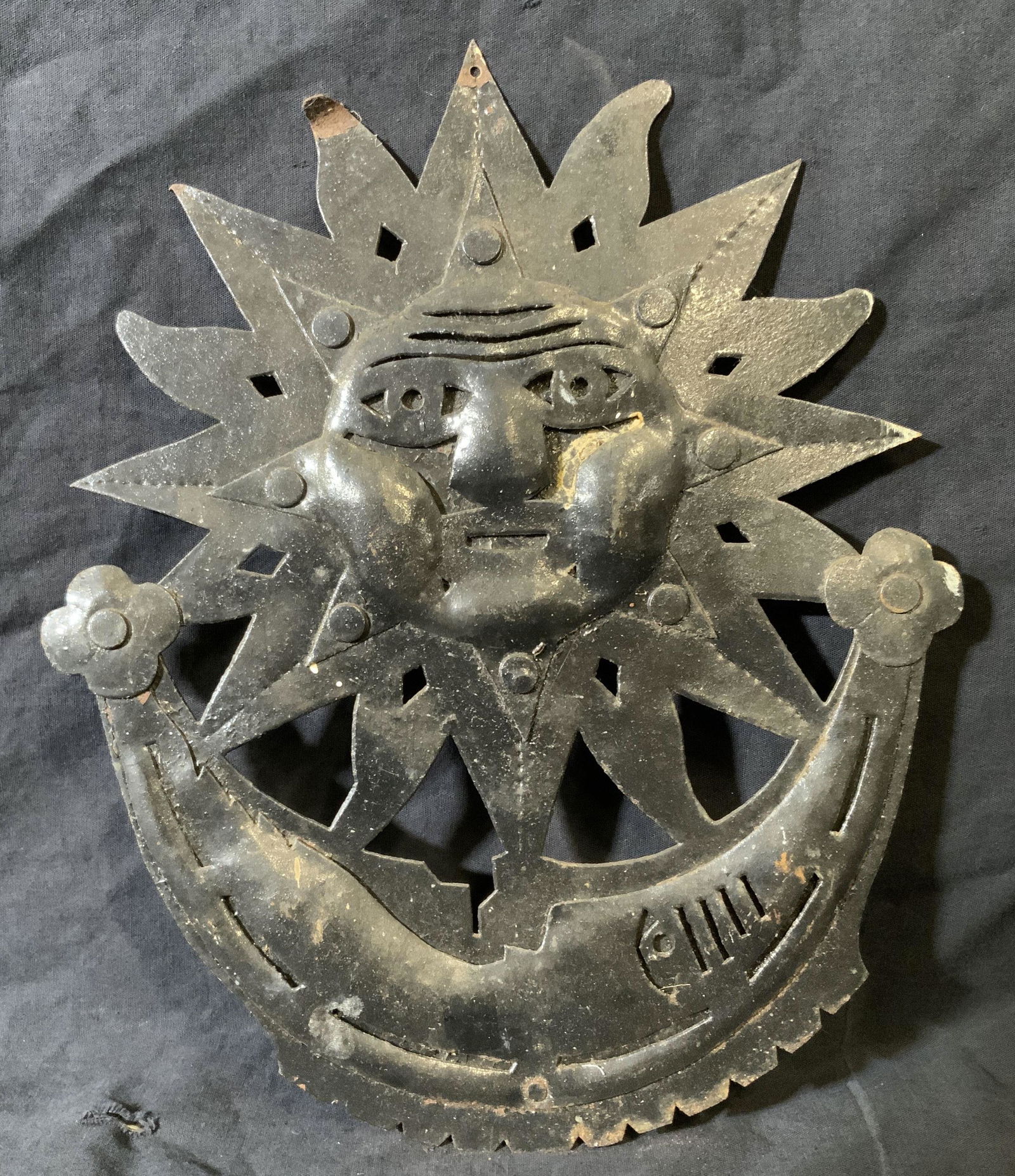 Vintage Metal Sun & Moon Wall Plaque: Vintage possibly antique Metal sun and moon wall plaque, no apparent inscriptions or markings, subject a sun and moon with faces locked in one another, piece measures 14 inches tall by 11 inches wide,