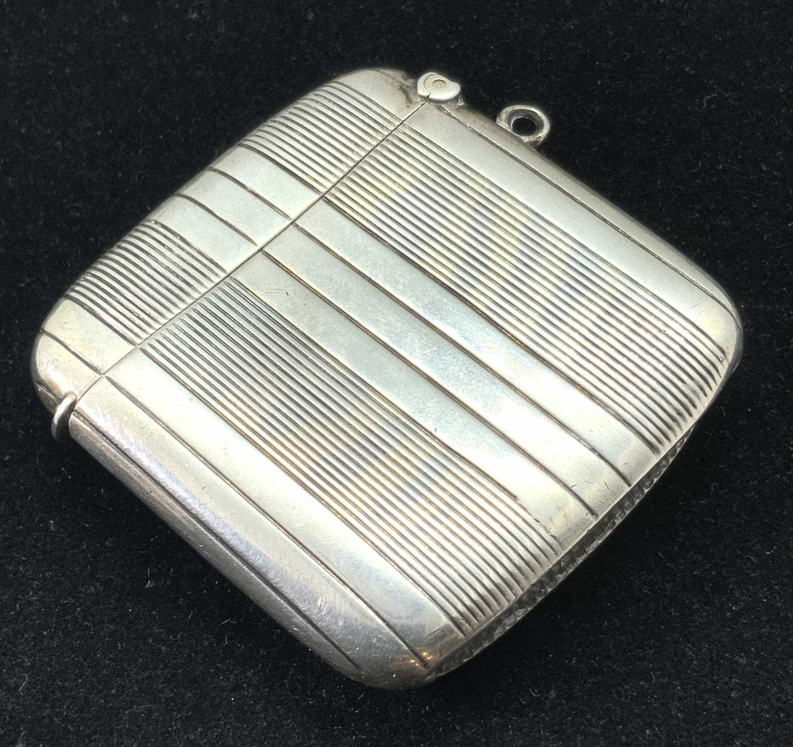 Vintage STERLING SILVER Match Safe Vesta: A vintage sterling silver lidded hallmarked match safe / vesta. The piece features etched bands along the entire piece. A bail on the side can be used to connect this piece to a chain or cord. The int